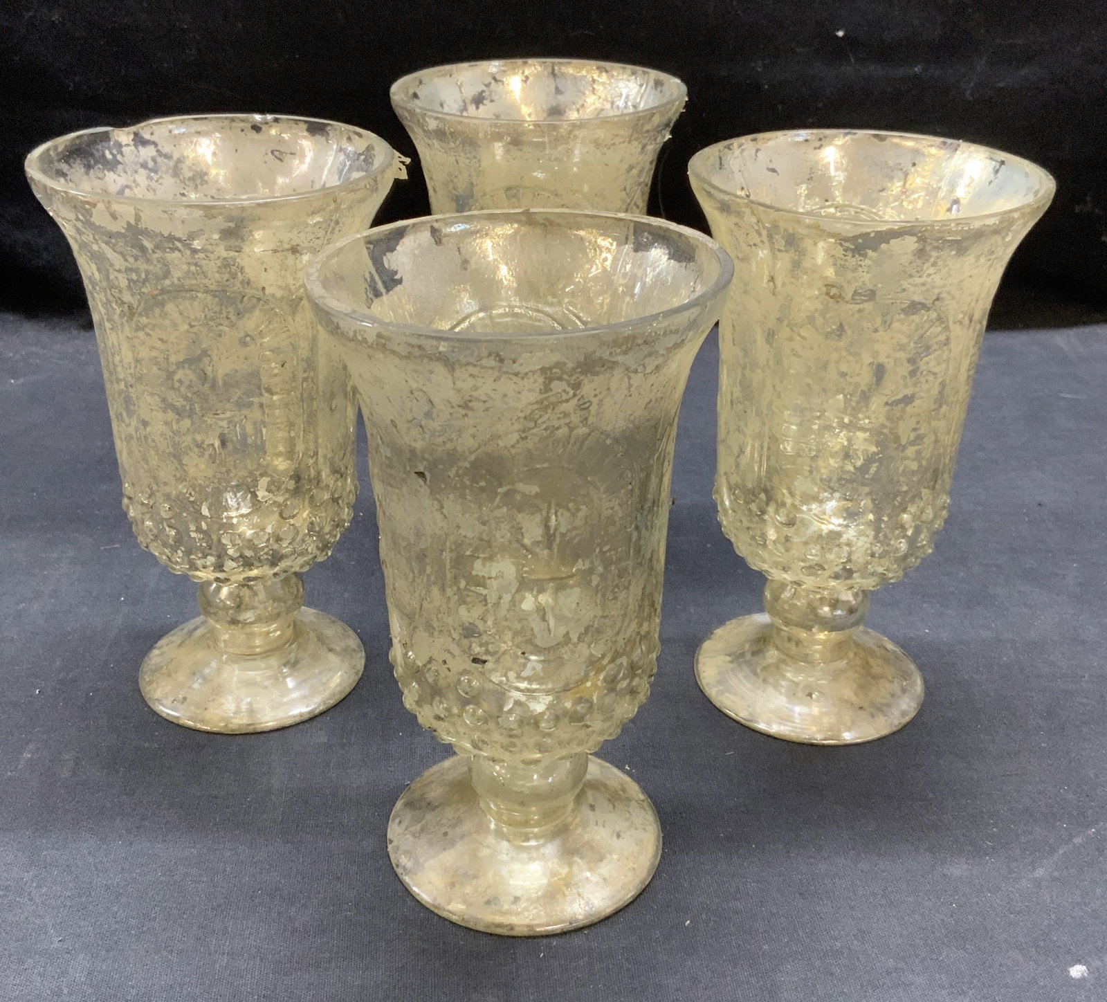 Set 4 Metallic Silver Tone Wine Glasses: Set of 4 embossed wine glasses with metallic silver finish. Decorate fleur de lis pattern. Measure approx. 3.5 x 6 inches each. Loss to finish and some chipping observed. Wine glasses, wine glass set,