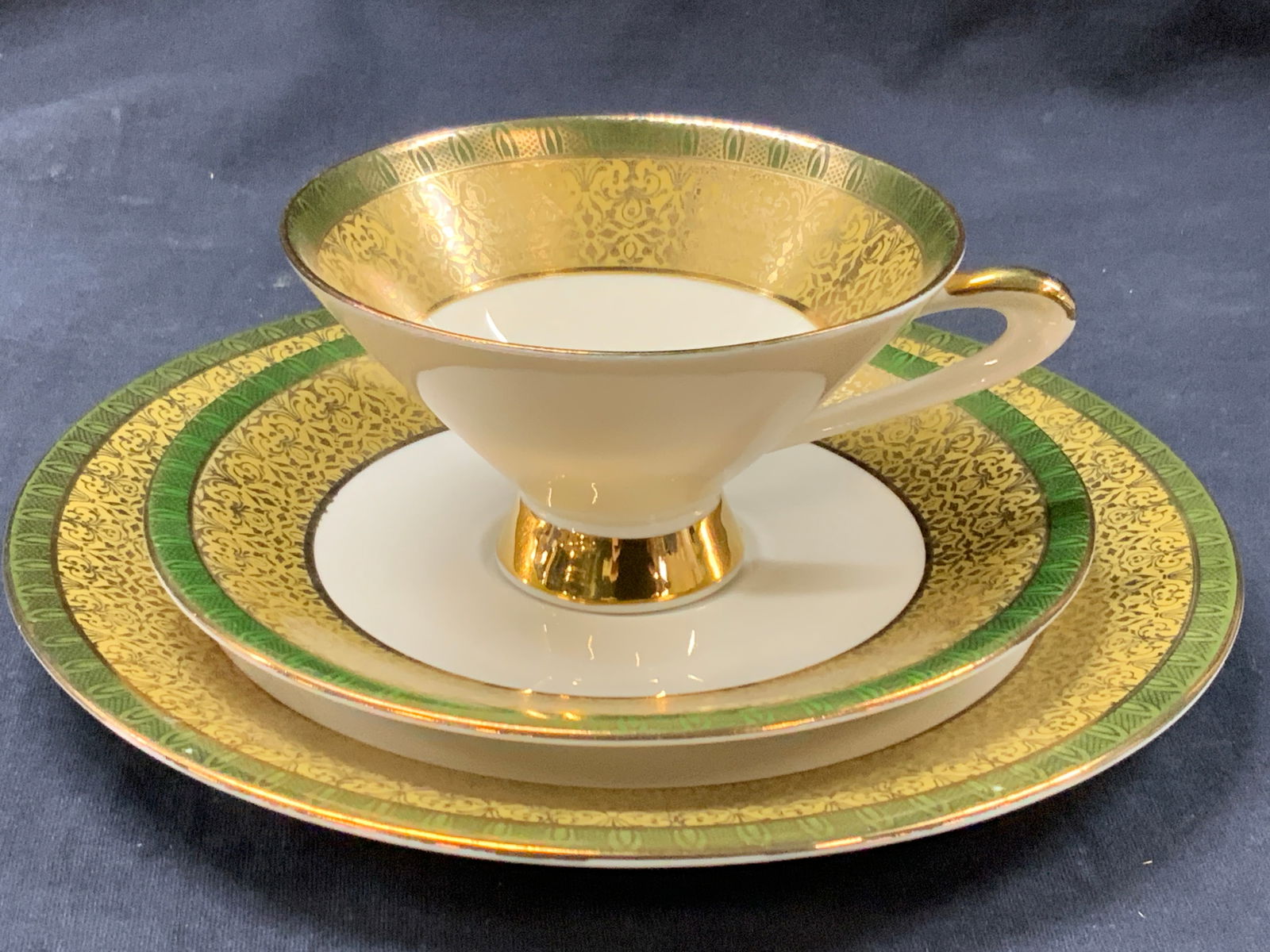 Set 3 Bavarian Germany Porcelain Teacup & Dishes: Set of 3 matching tea trio dish set. Matching tea cup, saucer and dish. Dish is approx 8 inch diameter, saucer is 6 inch and tea cup is approx 2.25 inches tall and 4 inch diameter. Each has green oute