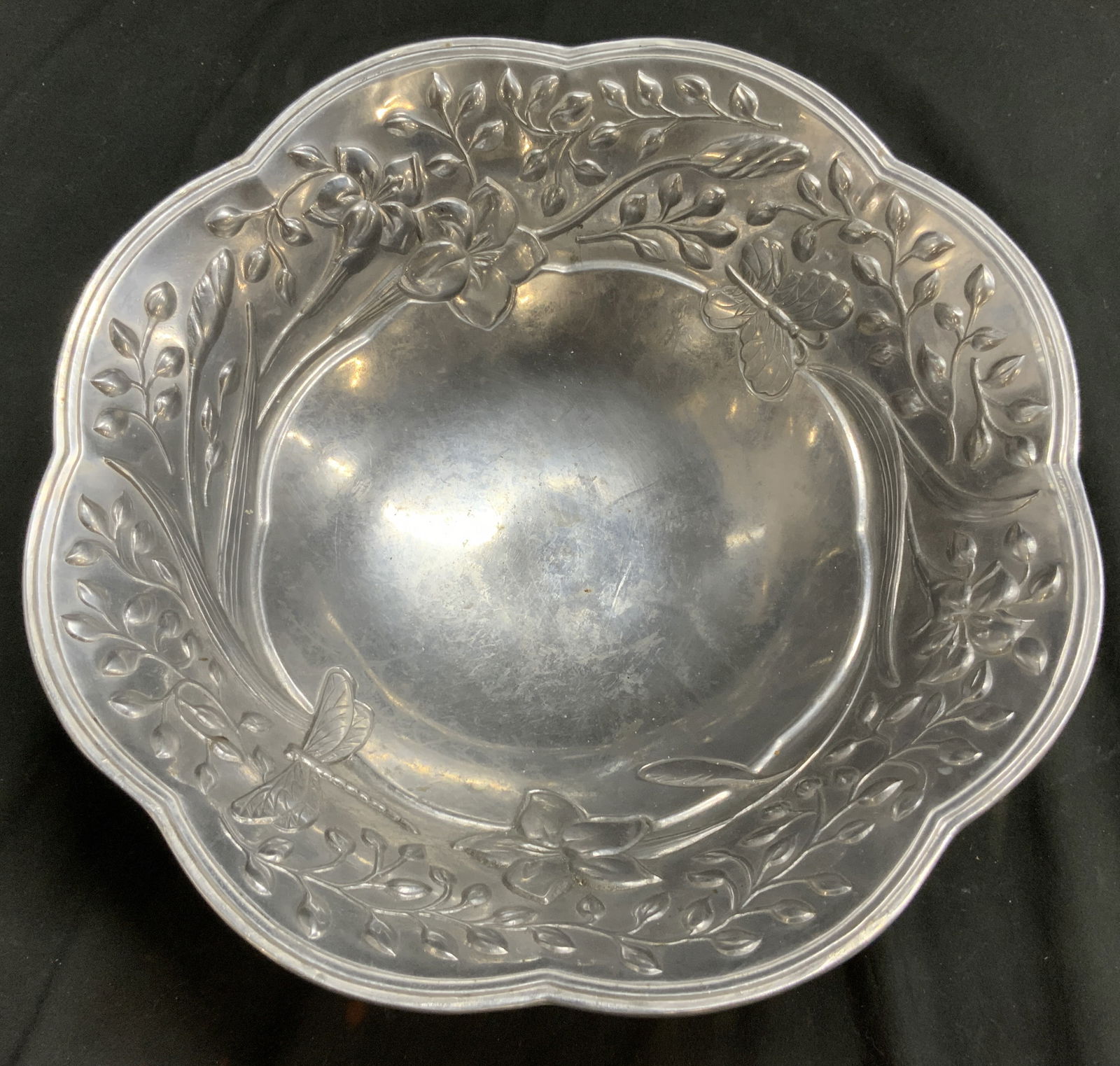 LENOX BUTTERFLY MEADOW Metal Serveware Bowl: Underside is inscribed LENOX. Tag reads BUTTERFLY MEADOW METAL SERVEWARE. Bowl is silver toned and metal, appears to possibly be pewter. Interior has butterfly, floral and leaf detail. Bowl resembles