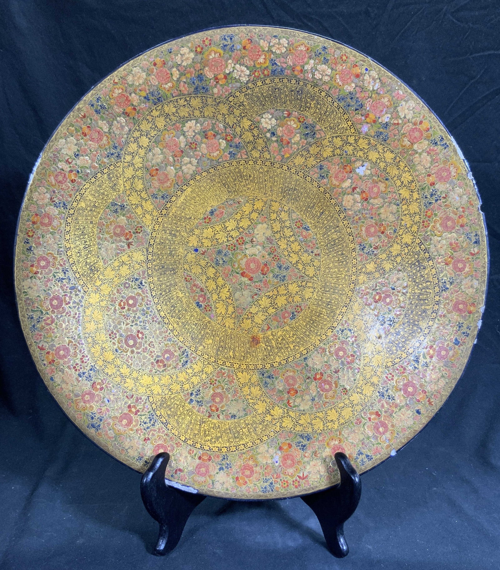 KASHMIR 20th C. Gilded Papier-Mache Lacquered Tray: Tray appears to be KASHMIR (No apparent markings) piece has intricate multi toned & gilt floral, leaf & geometric detail. Tray appears to be papier-Mache and lacquered. Tray has circular shape. Piece 