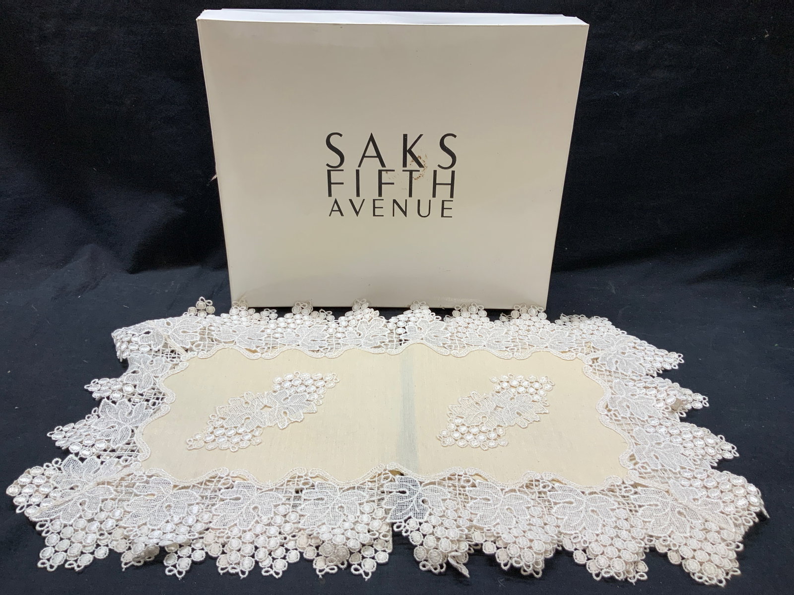 Set 4 Saks Fifth Ave Lace & Floral Table Mats: Set of 4 grape and leaf motifs lace and canvas centered table mats with embroidered lace made to resemble bunches of grapes. Approximately 26 x 15 inches Comes with white saks fifth Ave box. Approx 16