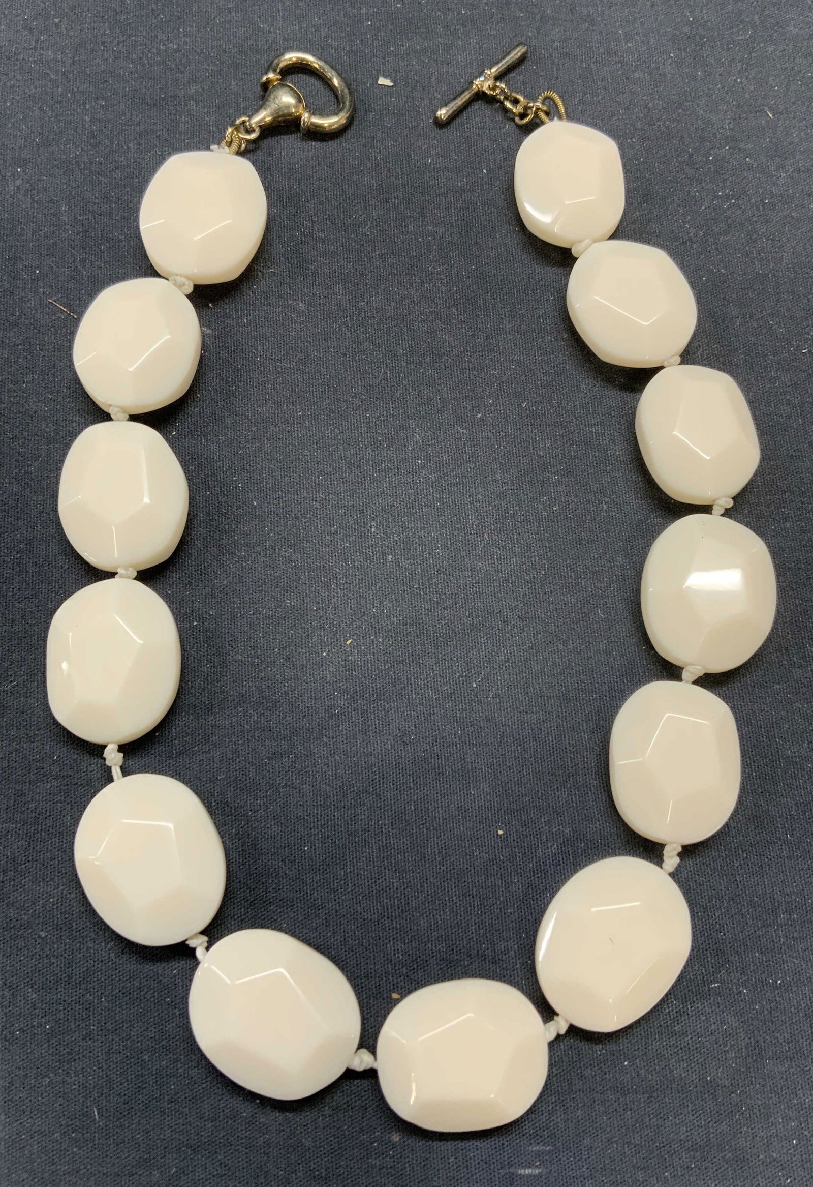 White Lucite Crystal Beaded Necklace: White lucite crystal beaded necklace on double knotted string. Drop length approx. 7.25 inches. Some scratching observed. Estate jewelry, costume jewelry, cocktail jewelry, fashion jewelry, accessorie