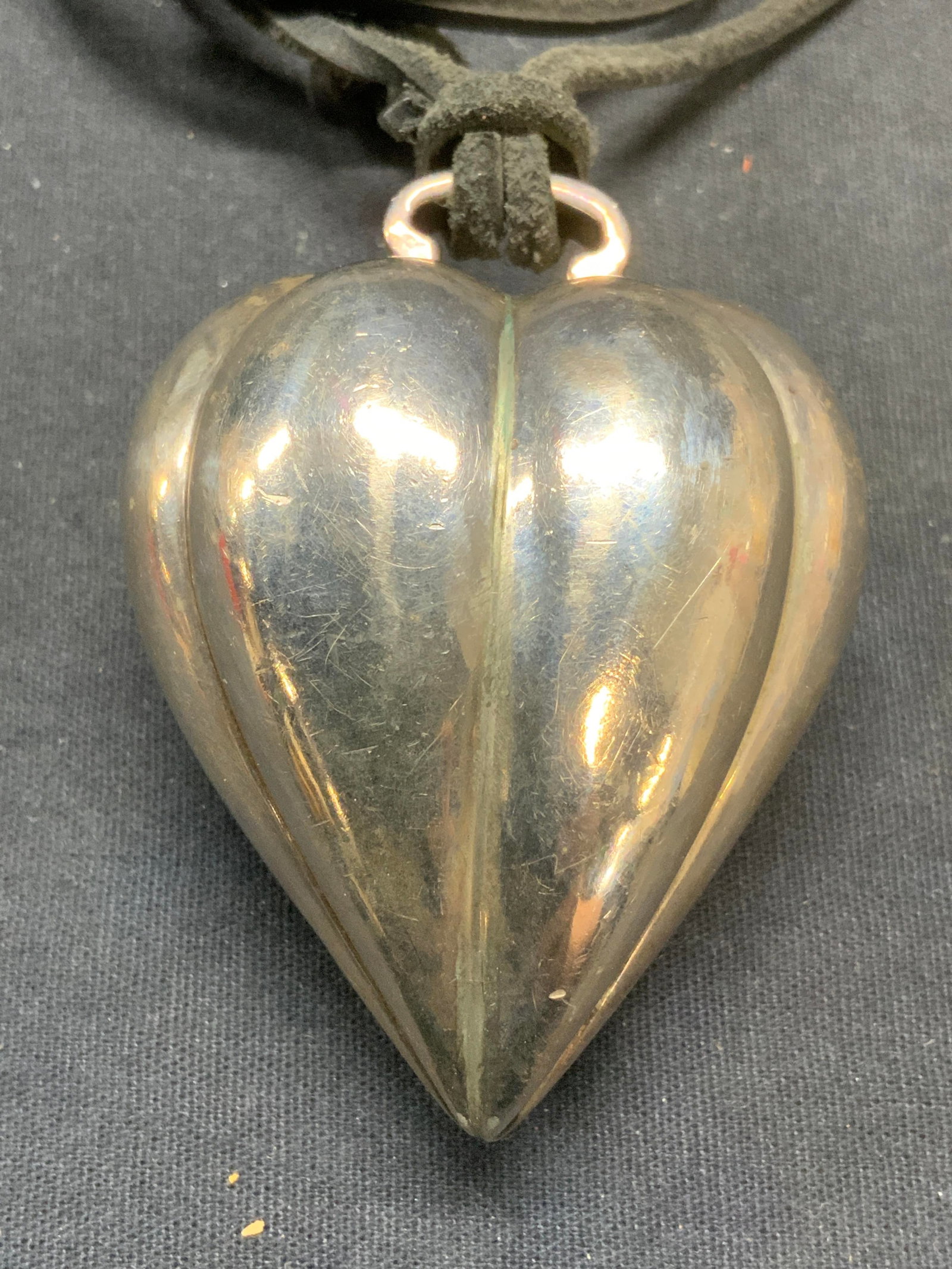 Vintage Silver Plated Heart Pendant Necklace: Vintage silver plated heart pendant necklace on black leather cord. Drop length approx. 20 inches. Pendant measures approx. 2.5 x 2 inches. Some scratching observed. Estate jewelry, costume jewelry, c