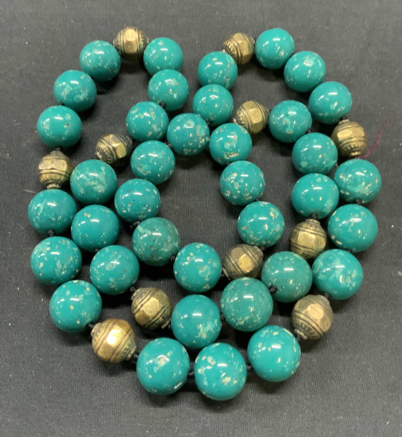Vintage Blue & Gold Tone Beaded Necklace: Vintage round blue beaded and hammered gold tone beaded necklace. Drop length approx. 16 inches. Some scratching observed. Estate jewelry, costume jewelry, fashion jewelry, cocktail jewelry, accessori