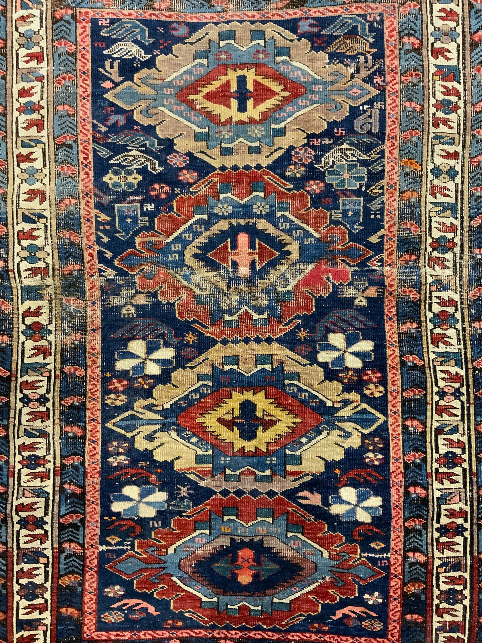 Vintage Handmade Persian Wool Rug: Rug is handmade and wool. Piece appears to be Persian. Piece appears to be antique possibly vintage. Rug has intricate multi toned geometric detail. Piece measures approx 58 inches long 40 inches wide