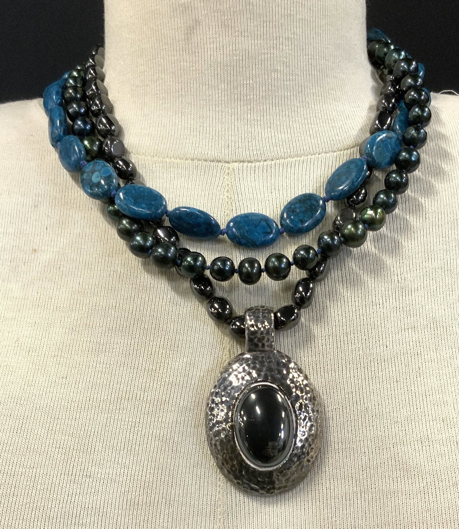 SSD Sterling Silver Necklace w Peacock Pearls Gems: Handmade triple strand gemstone necklace with sterling silver hook clasp and sterling silver chunky pendant. Pendant is hammered sterling with a center hematite stone, backside is marked SSD 925. Meas