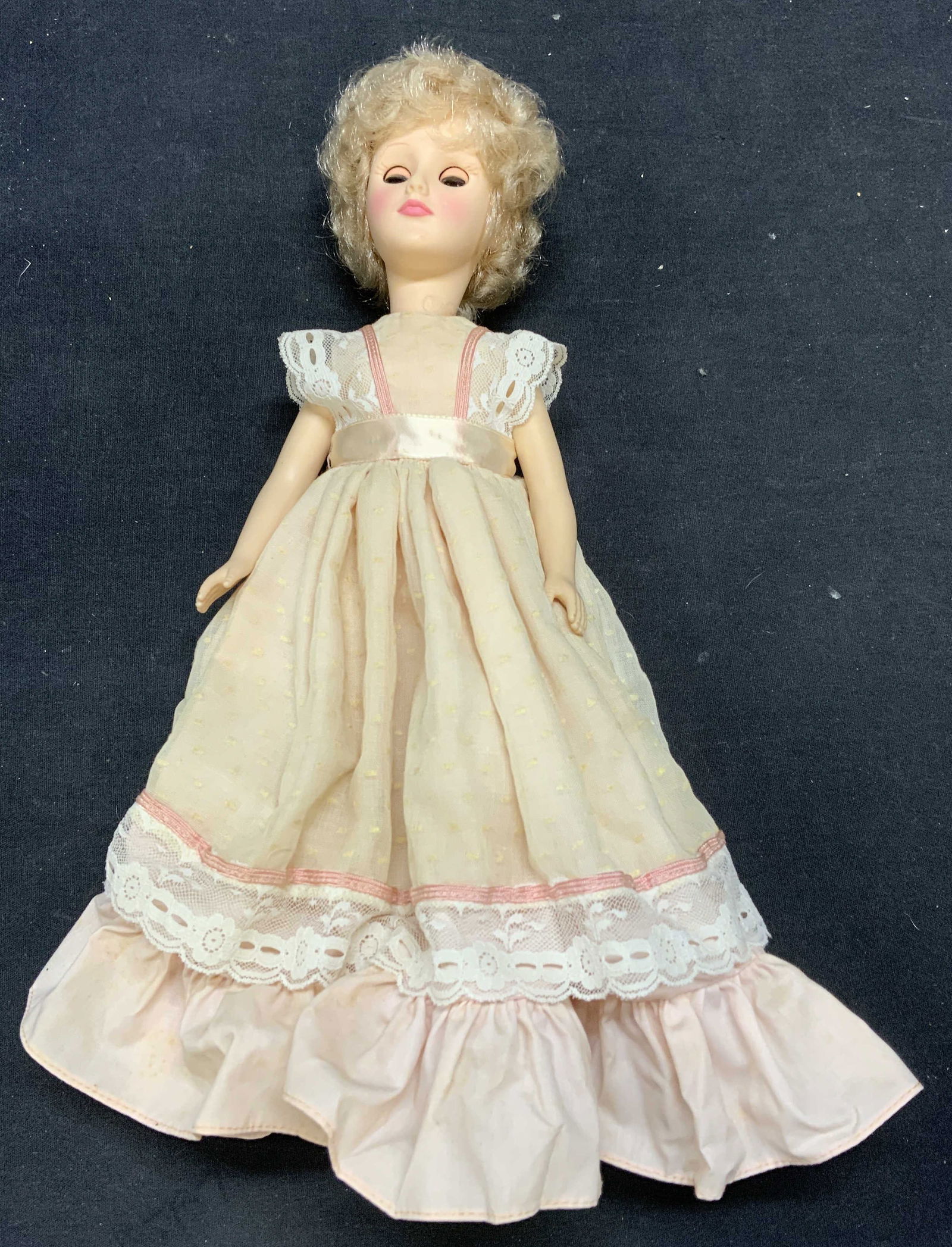 Vintage EFFANBEE Doll w Pink Dress: Vintage EFFANBEE doll with pink dress. Trademarked on back of neck. Measures approx. 12 inches long. Composed of fabric and plastic. Some wear to material consistent with exposure. EFFANBEE, EFFANBEE