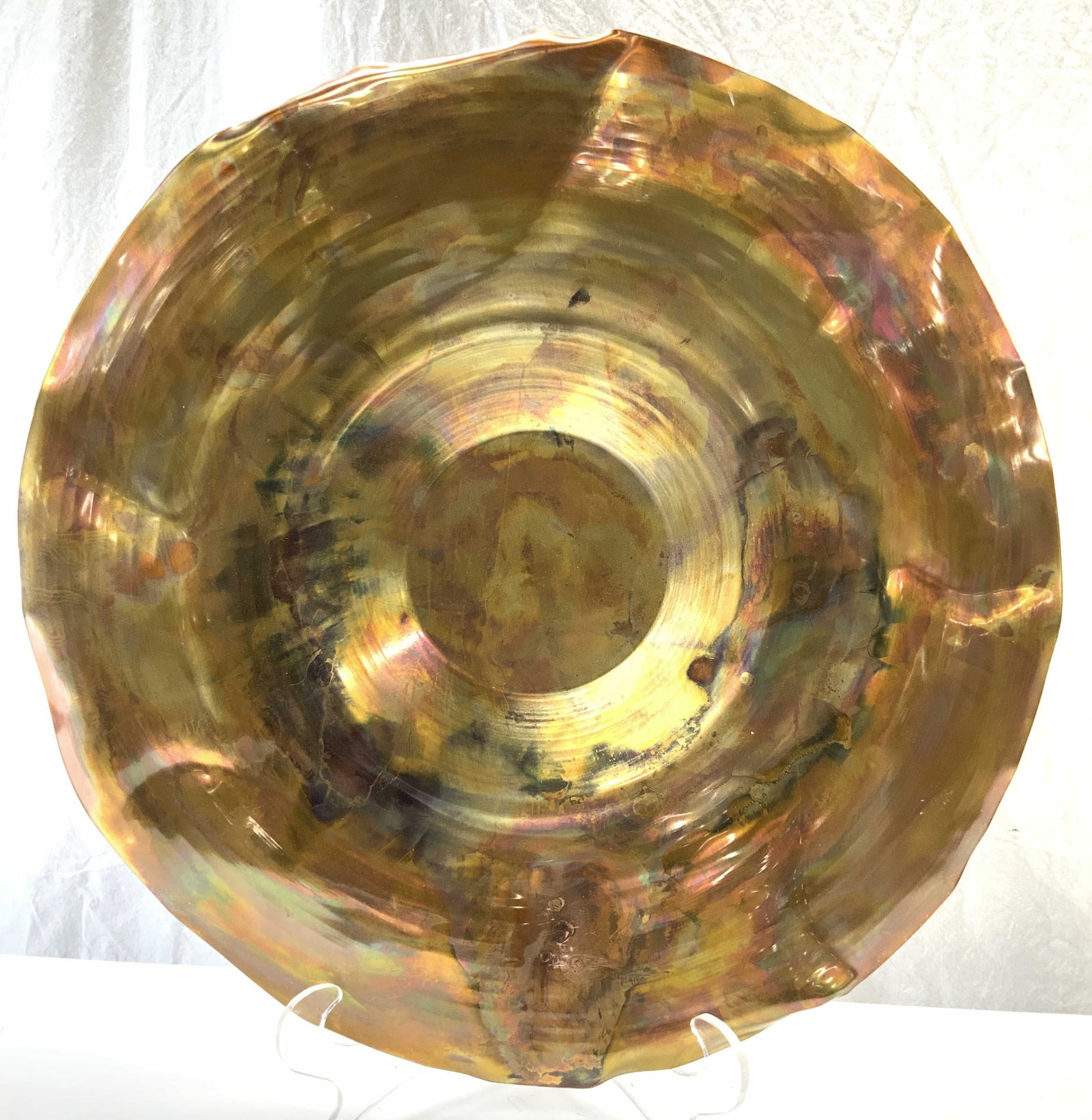 XL Artisan Torched Copper Centerpiece Charger: Extra Large Copper Sheet metal crafted into a centerpiece charger plate. Approx 22.25-22.5 in. Diameter. Hand Crafted. Torched copper that brings out a rainbow palette , bent and contorted for design 