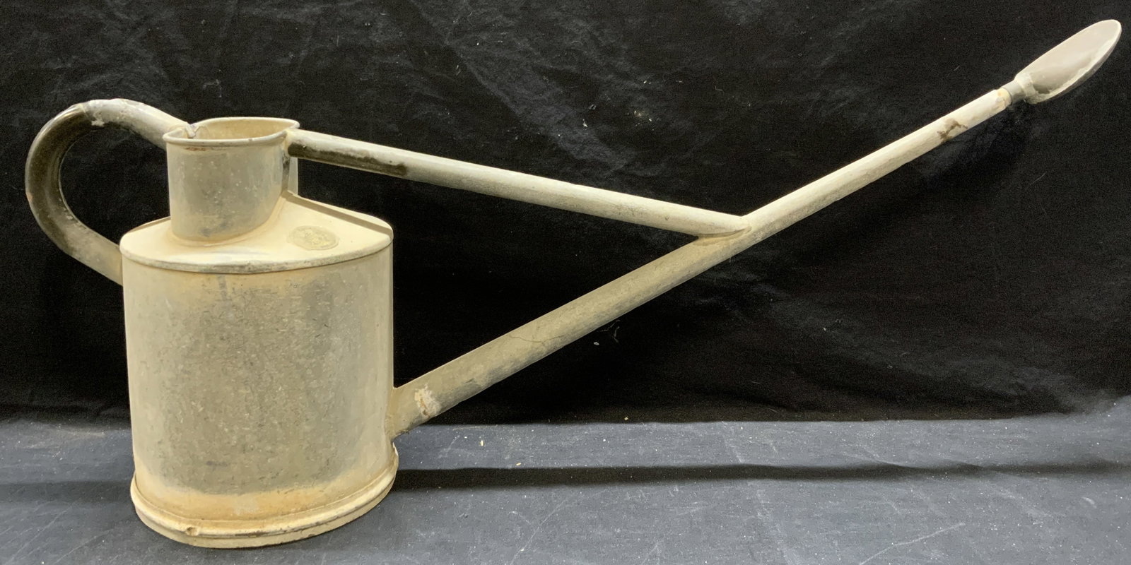 Vintage Haws Tala Works Watering Can, England: Vintage, possibly antique, Haws Tala Works tin watering can. Trademarked on metal. Made in Stourbridge, England. Surface wear consistent with exposure. Pitting observed. Measures approx. 34.5 x 8 x 15