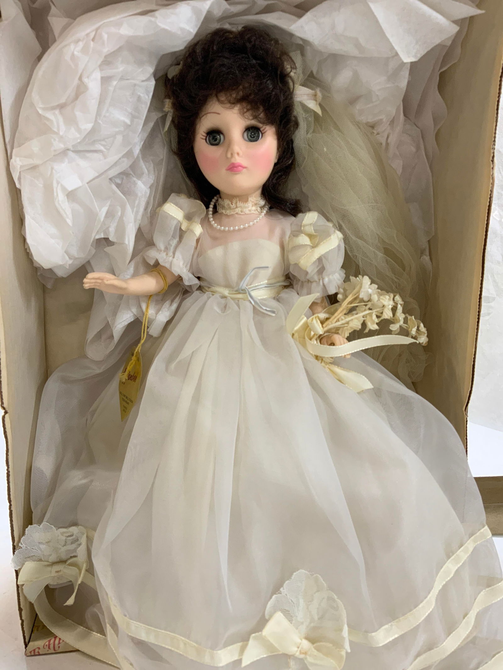 EFFANBEE Bridal Doll w Stand, Org Box, USA: EFFANBEE bridal doll with articulated arms, legs and head. She has pink lips, blue eyes, and brown hair. Her eyes will close when she lays flat. Original doll label hangs from her arm. She comes with