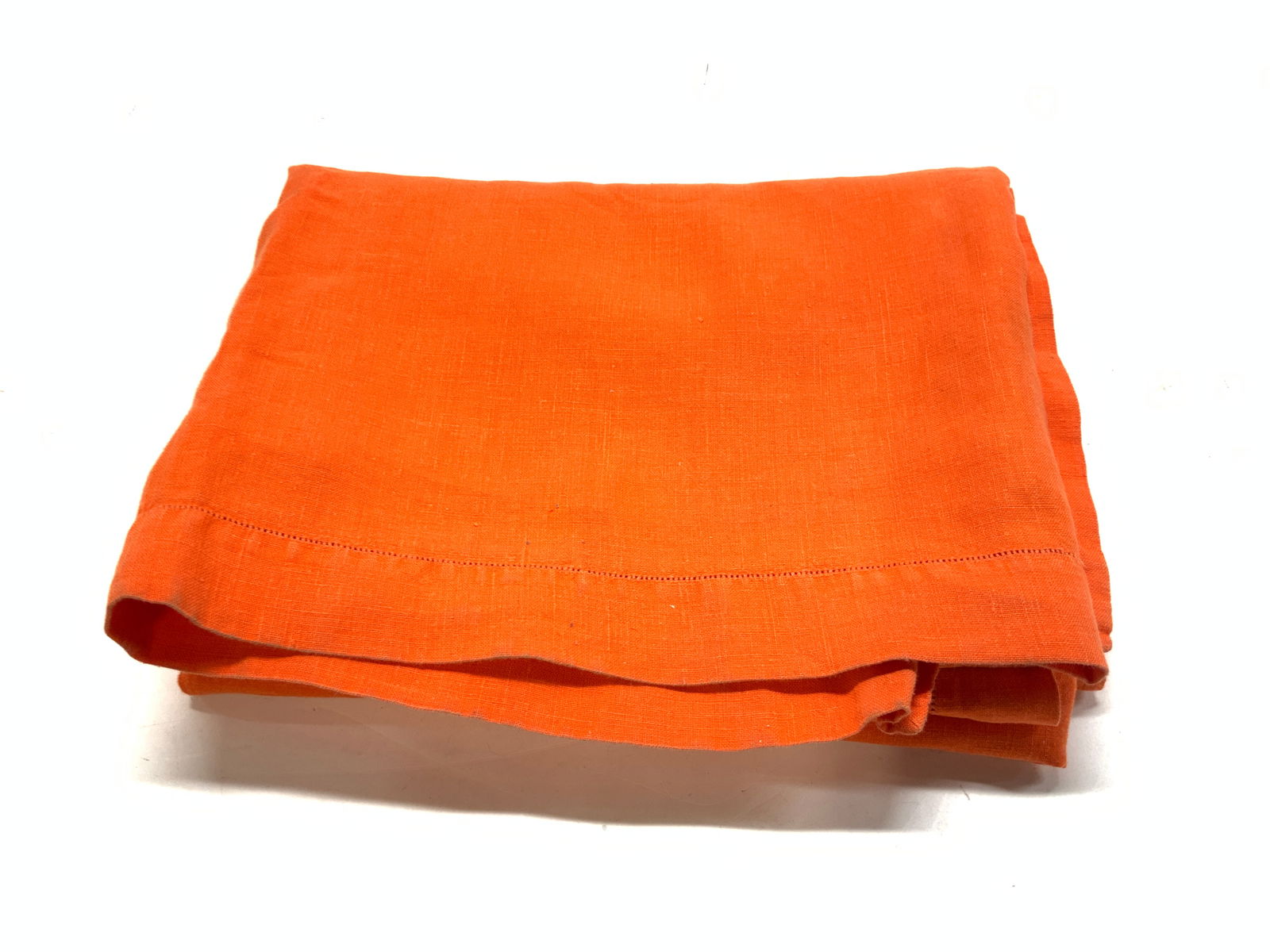Bright Orange Linen Tablecloth: Thick linen tablecloth in a vibrant orange. Rectangular shape, measures 94 in. x 59 in. General surface wear and punctures noted. Orange linen tablecloth, Linen table clover, tableware, table linens,