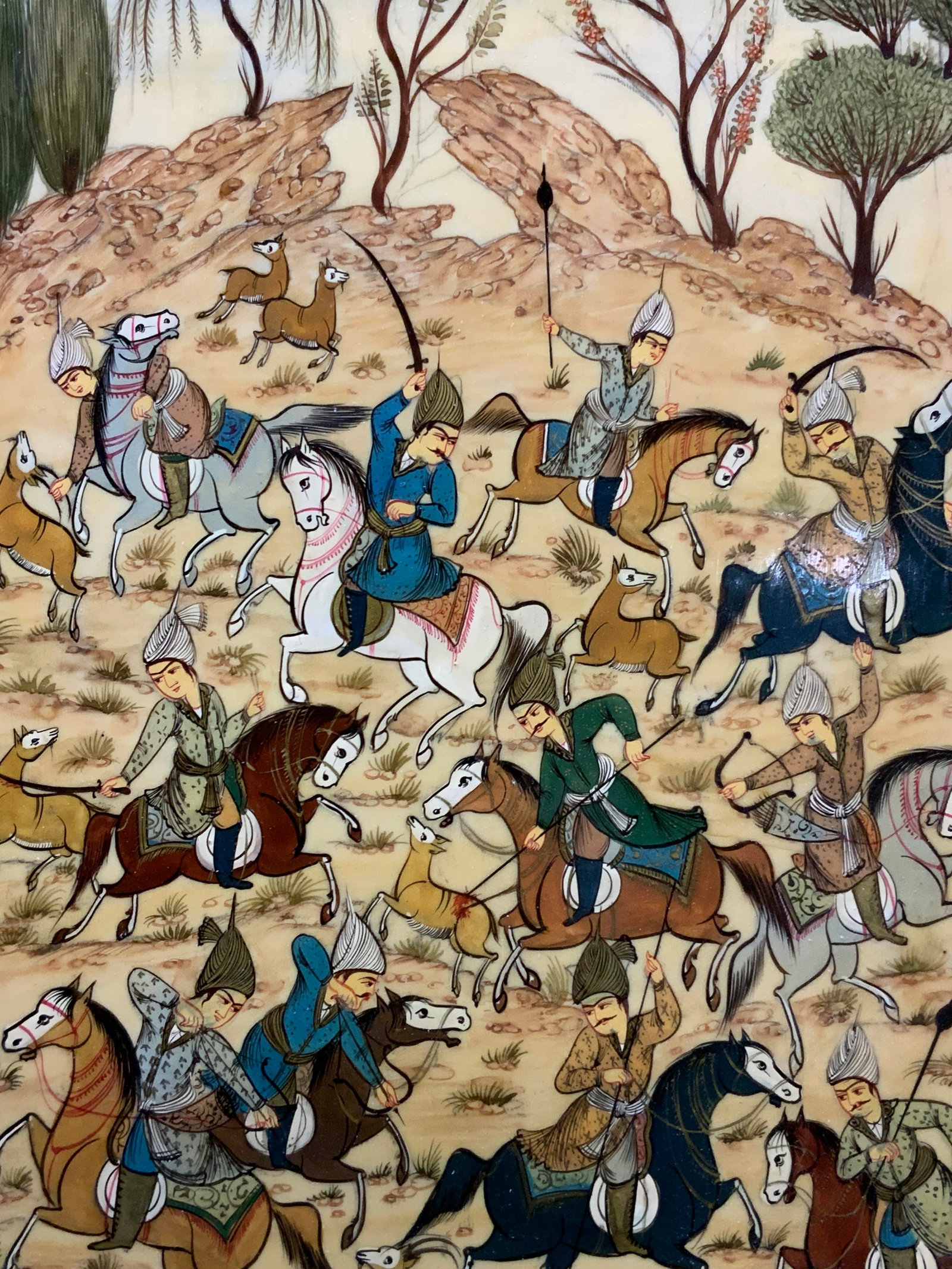Vtg Persian Hunting Scene Painting On Bone: Vintage Persian painting, possibly on bone. Depicting various men on horses hunting deer. Framed in a gold leafed and black painted wooden frame. Approx 19 x 13 inches, window measures 15 x 9 inches. 