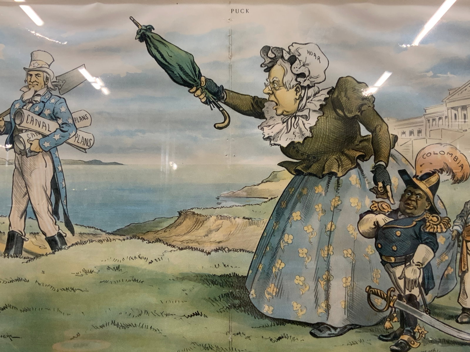 Antq Puck Full Color Political Cartoon: Copyright By Keppler & Schwarzman. Marked Puck on upper margin, and reads still Scolding, depicting Hoar dressed as an elderly woman yelling at Uncle Sam whose holding Canal plans with Colombia and Ph