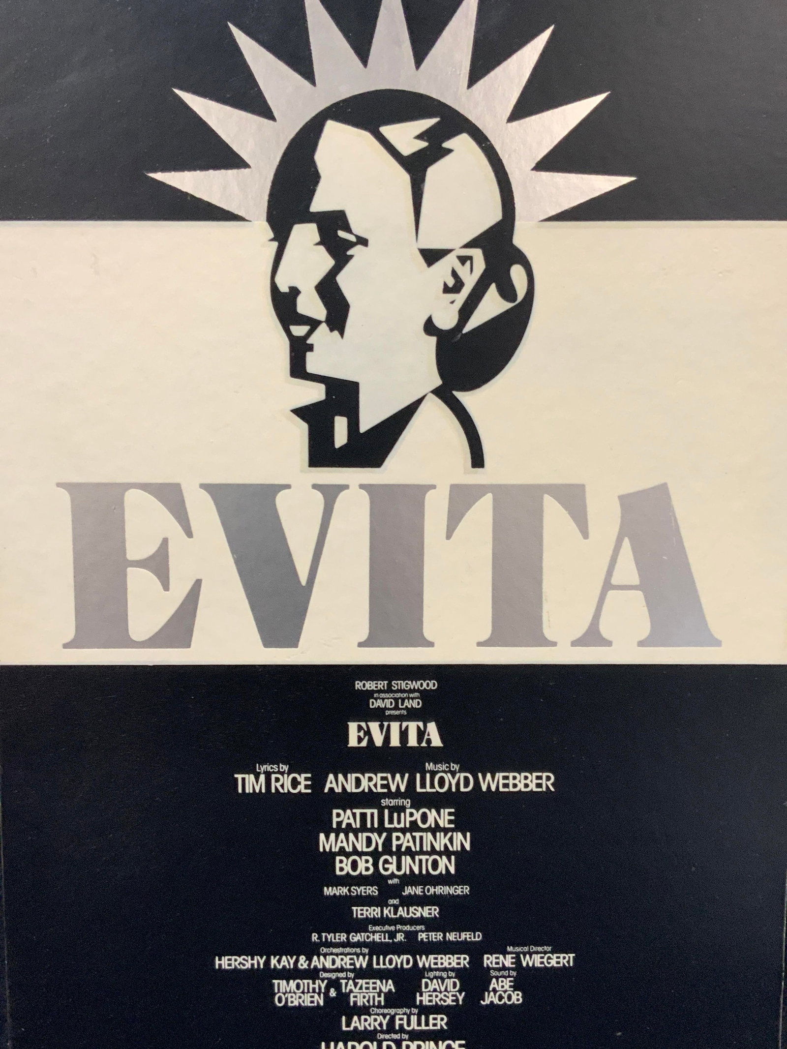 Evita Broadway Patti Lupone Musical Advert: Black and white Broadway Theatre advert for Evita, original cast with Patti Lupone. Marked Broadway Theatre, N.Y.C. Litho affixed to a wooden backing. No frame. approx 22 x 14 inches Moderate wearing 