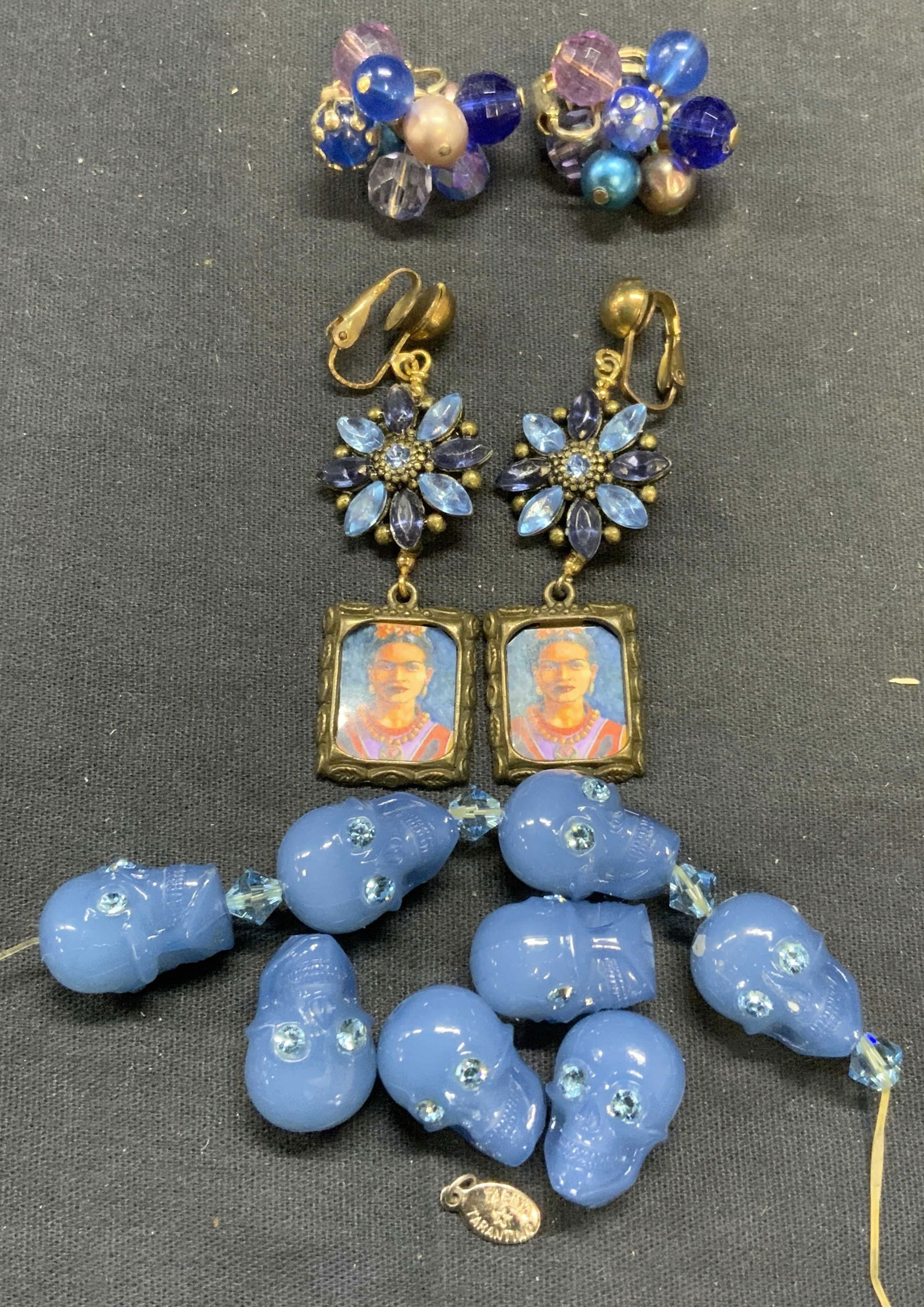 Lot 3 Tarina Tarantino Skull Bracelet, More: Lot of 3 jewelry pieces. Tarina Tarantino blue lucite skull beaded bracelet with blue crystal accents. Bracelet needs to be restrung. Skull beaded measure approx. .75 inches long. Blue crystal and fau
