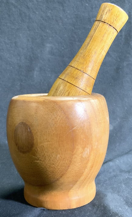 Vintage Carved Wooden Mortar & Pestle: Lot includes 1 mortar and 1 pestle. Set is beige toned, appears to be vintage. Mortar has foot to base. Mortar measures approx 4 inches tall & wide pestle 5.5 inches long. Mortar and pestle, vintage m