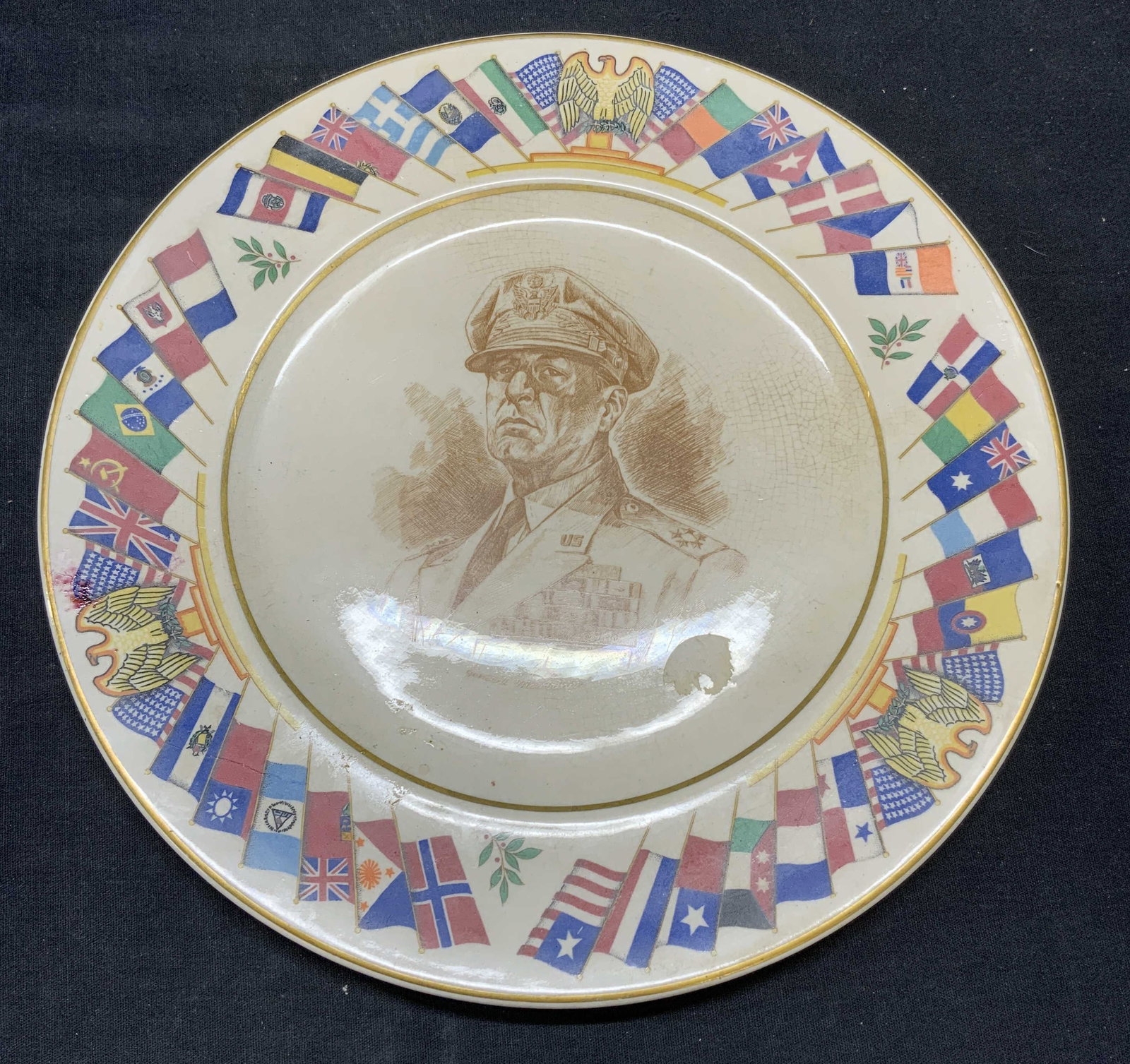 Vtg Old Colony China Allied Nations Plate: Vintage Old Colony China plate. Allied Nations series. Image of General MacArthur and Allied nation flags. Trademarked to underside. Measures approx. 11 inches diameter. Surface wear including scratch