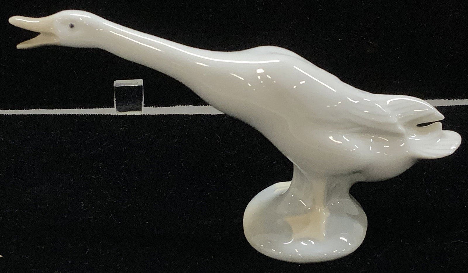 Lladro Porcelain Swan/Goose Figural, Spain: Handmade Lladro porcelain figural of a goose/ swan. Hallmarked on underside . Also has an impressed #5 mark. Measures 7 in. Long, 3.5 in. Ht. Lladro porcelain animal figural, Lladro Goose Figural, Lla