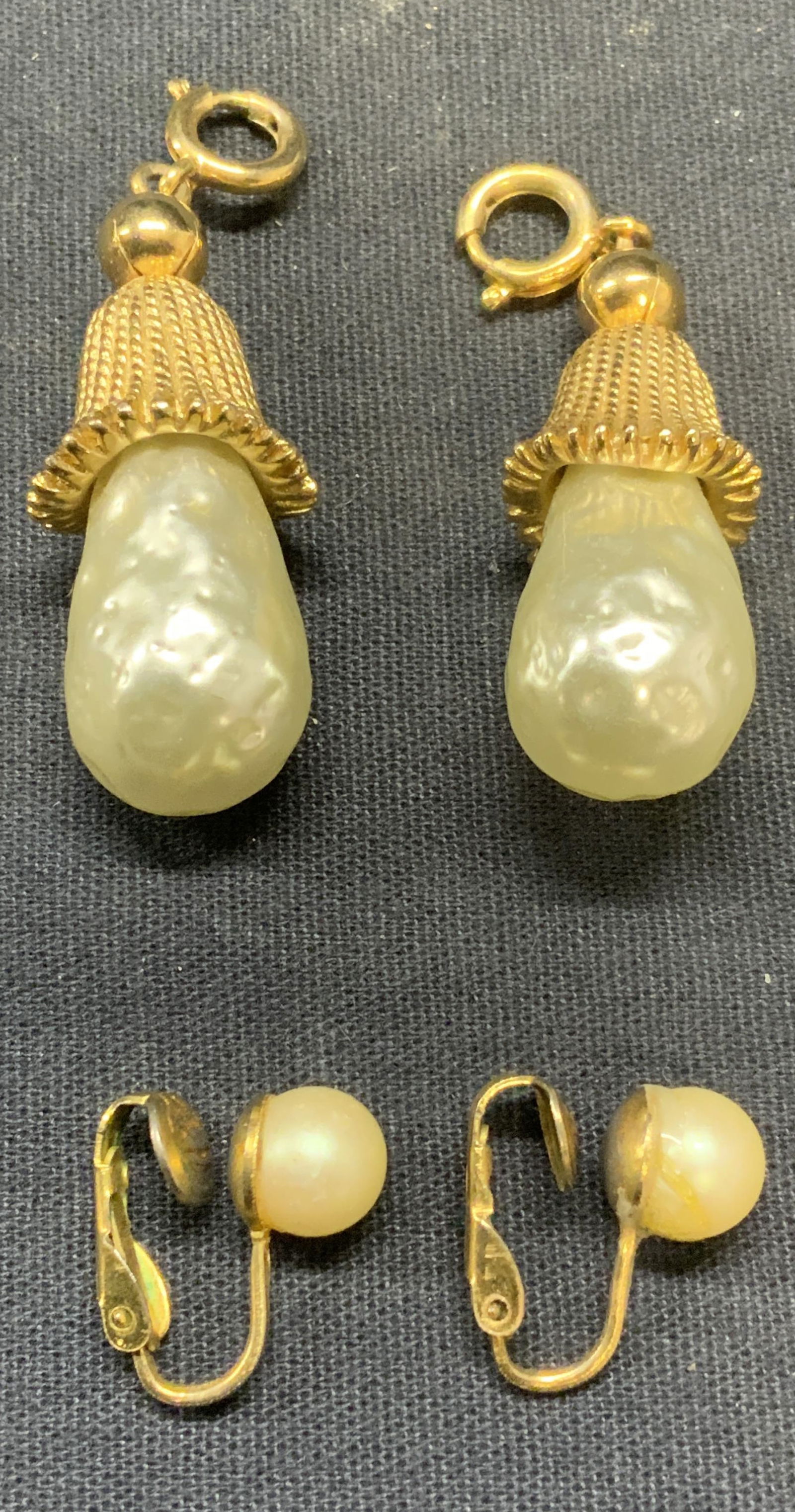 Lot 3 Gold Tn Faux Pearl Pendants & Earrings: Lot of 2 matching gold tone Paix baroque pearl pendants. Measure approx. 1.5 inches long each. 1 pair vintage gold tone faux pearl clip on stud earrings. Measure approx. 5/8 inches long. All pieces ha
