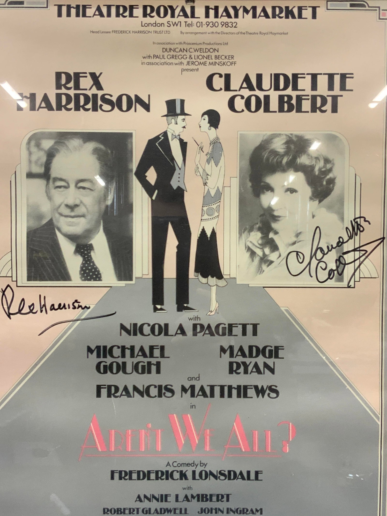 Rex Harrison & Claudette Colbert Sgd Poster: Advert for the play Arent we all? With signatures from the leads, Rex Harrison and Claudette Colbert in black ink over the pink and gray poster. Framed in a pink toned metal frame, approx 22 x 14 inch