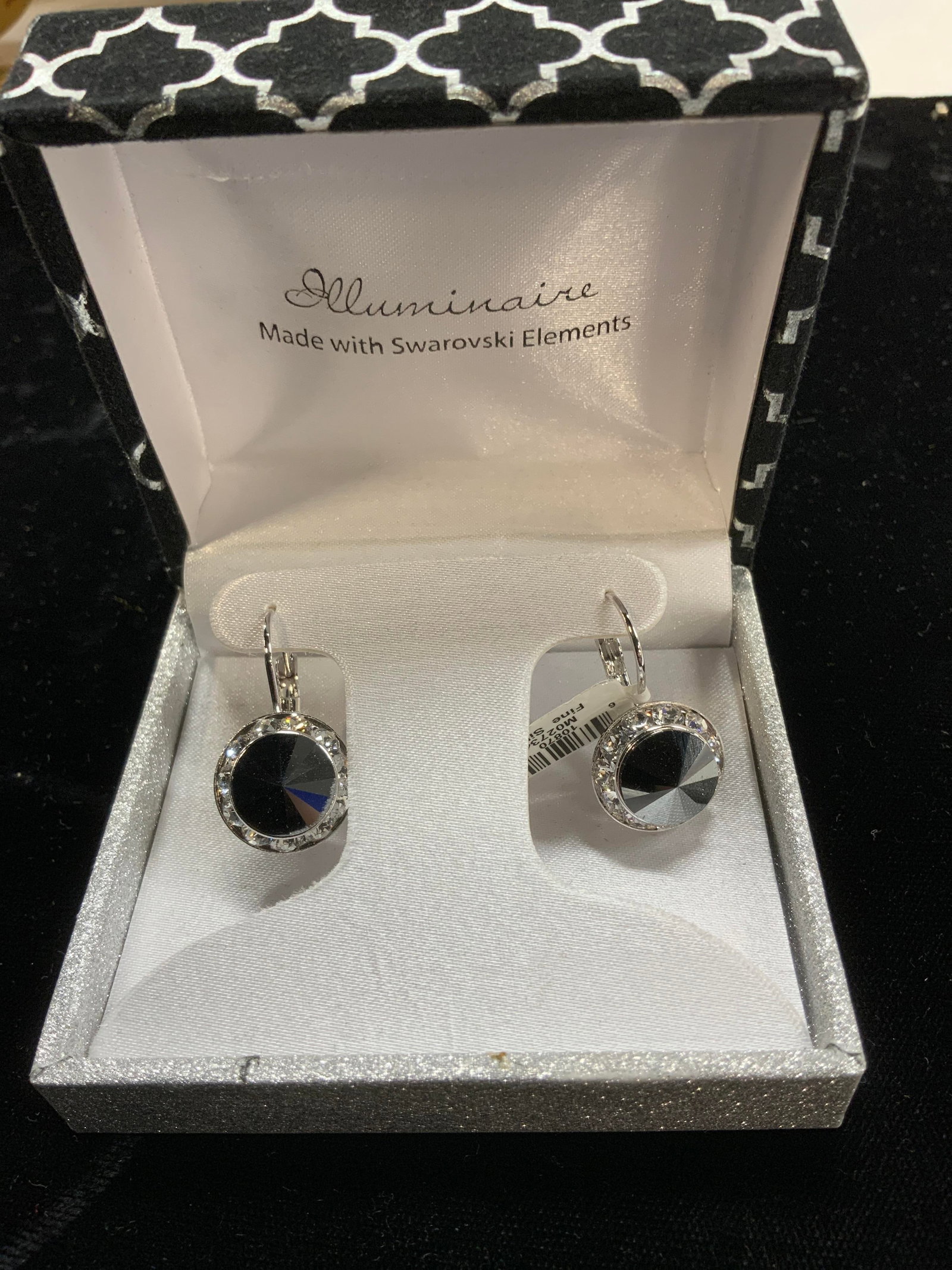 Illuminaire Swarovski Crystal Earrings NIB: Illuminaire silver plate lever back earrings . Center faceted hematite ( pointed tip) halo clear Swarovski crystals . 15 mm wide. 1 in. Drop , never worn, new in box with original tag attached. Luxury
