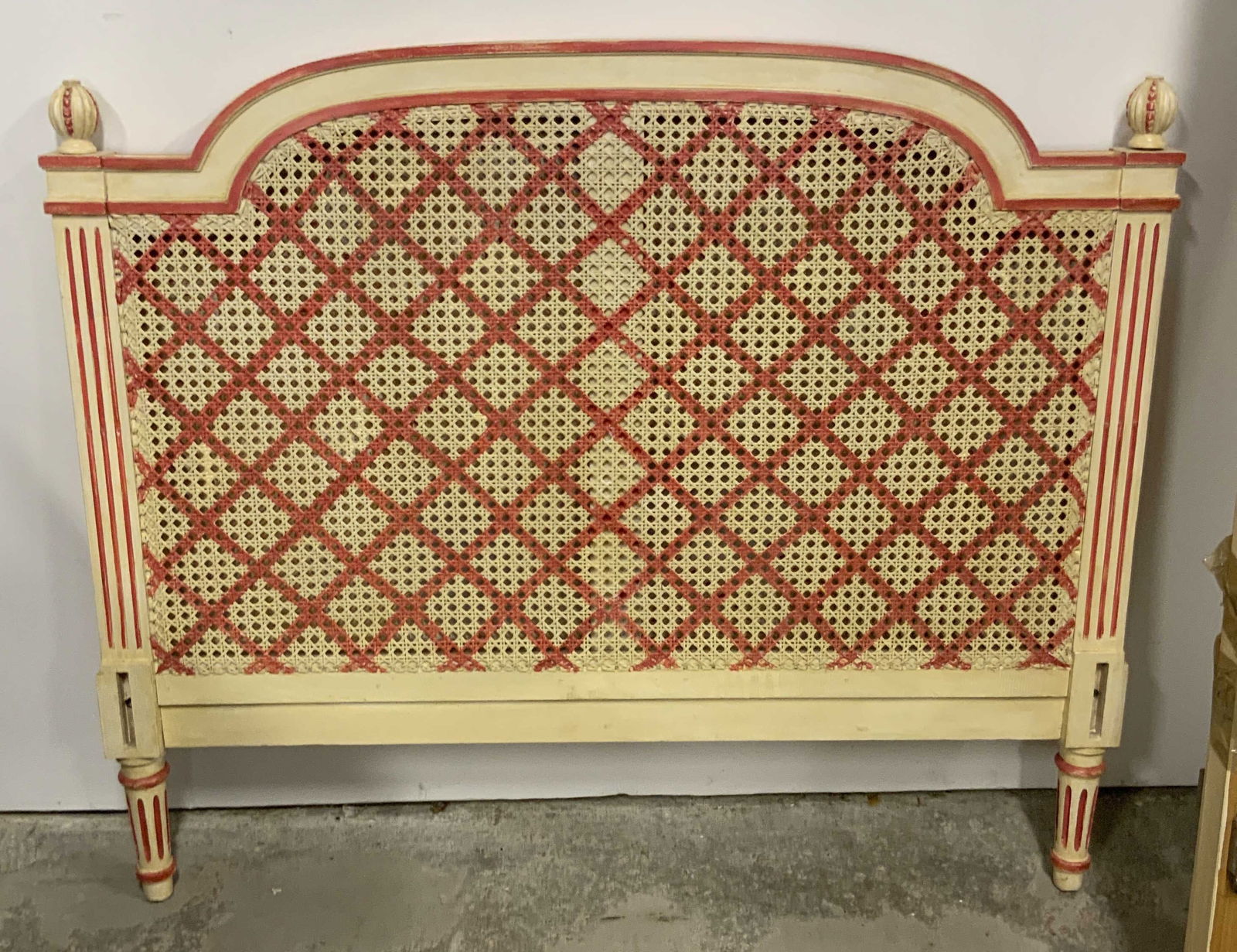 Vintage Painted & Carved Wood Caned Headboard +: A lot consisting of a carved and painted headboard & footboard as well as other bed frame pieces. The headboard and footboard are caned and feature floral motifs amongst the wood carvings. Headboard a