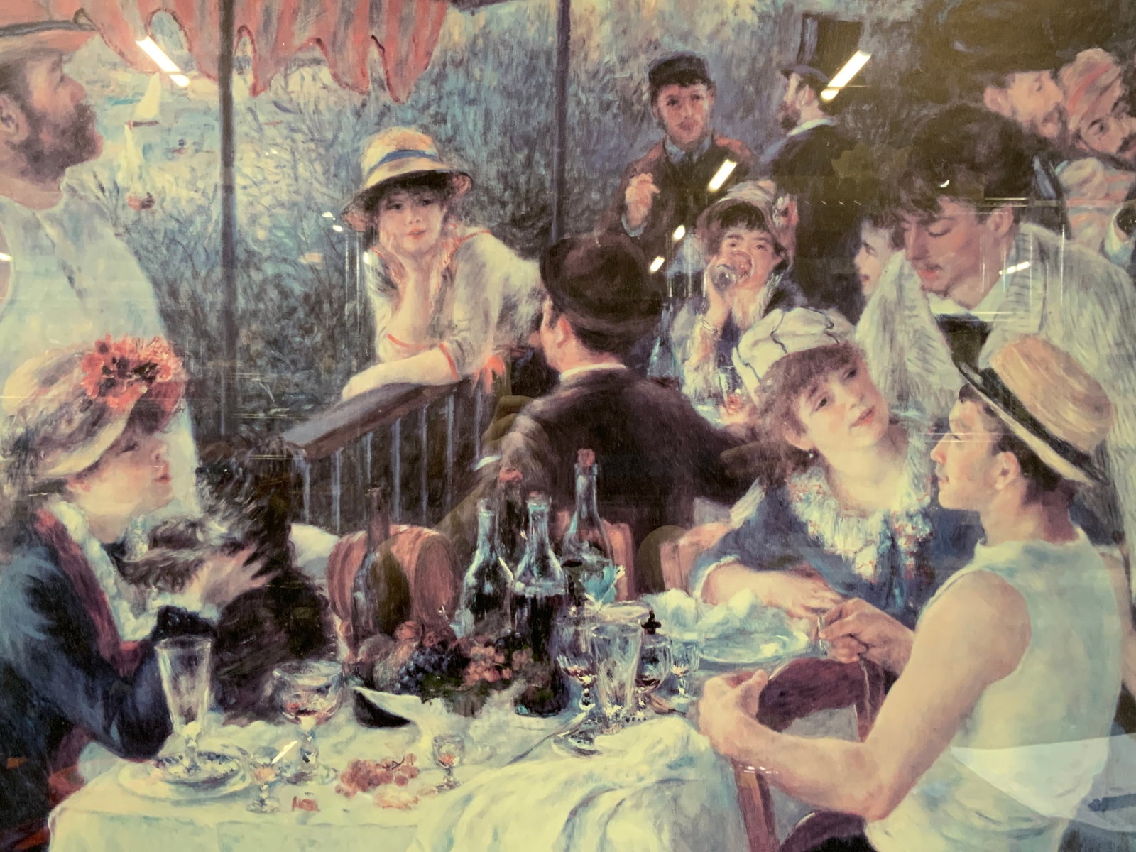 Renoir Luncheon Of The Boating Party Litho 35in: Lithograph of Renoir painting Luncheon of the boating party. Depicting the various people, men and woman around tables and chatting. Framed in a gold leafed wooden frame with white and gold leafed mat