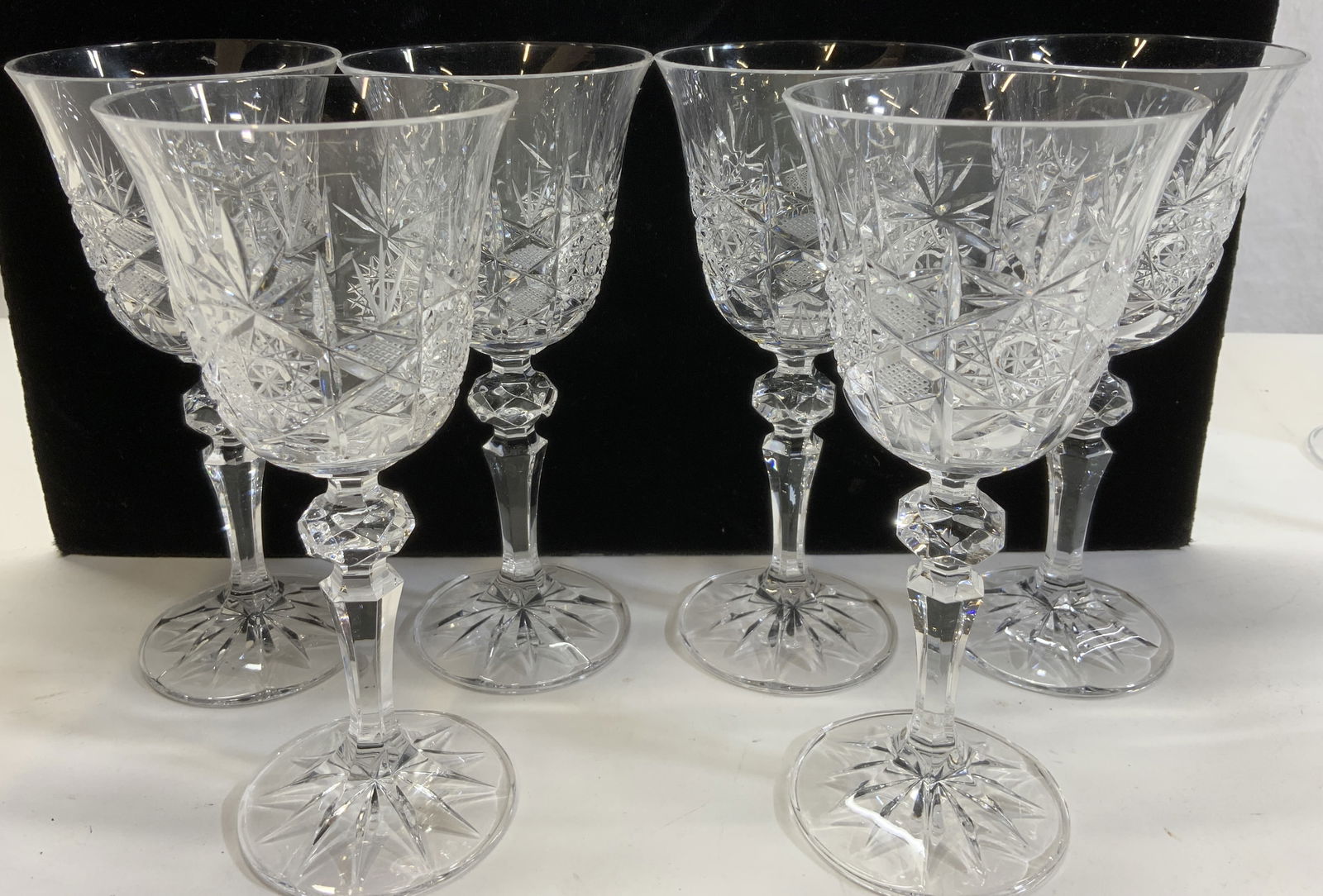 10 Vintage Cut Crystal Stemware Goblets: Hand cut crystal stemware glasses with multiple cut patterns, reverse bell shape. Faceted stems with faceted orb ornament. Set of 6 glasses, 6.5 x 3 in. Set of 4 thick and heavy lead crystal stemware
