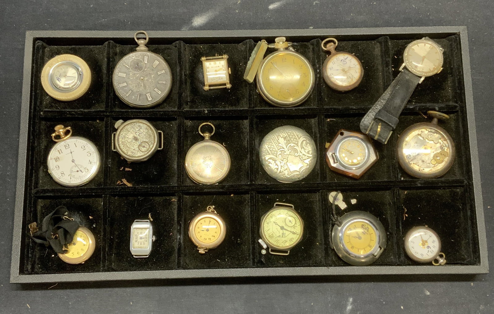 Group Lot 18 Vtg Pocket Watches, Watch, More: Group lot of 18 vintage pocket watches and more. Includes gold and silver tone pocket watches, one crystal wrist watch, one pocket watch backing, and two watch faces. Largest pocket watch measures app