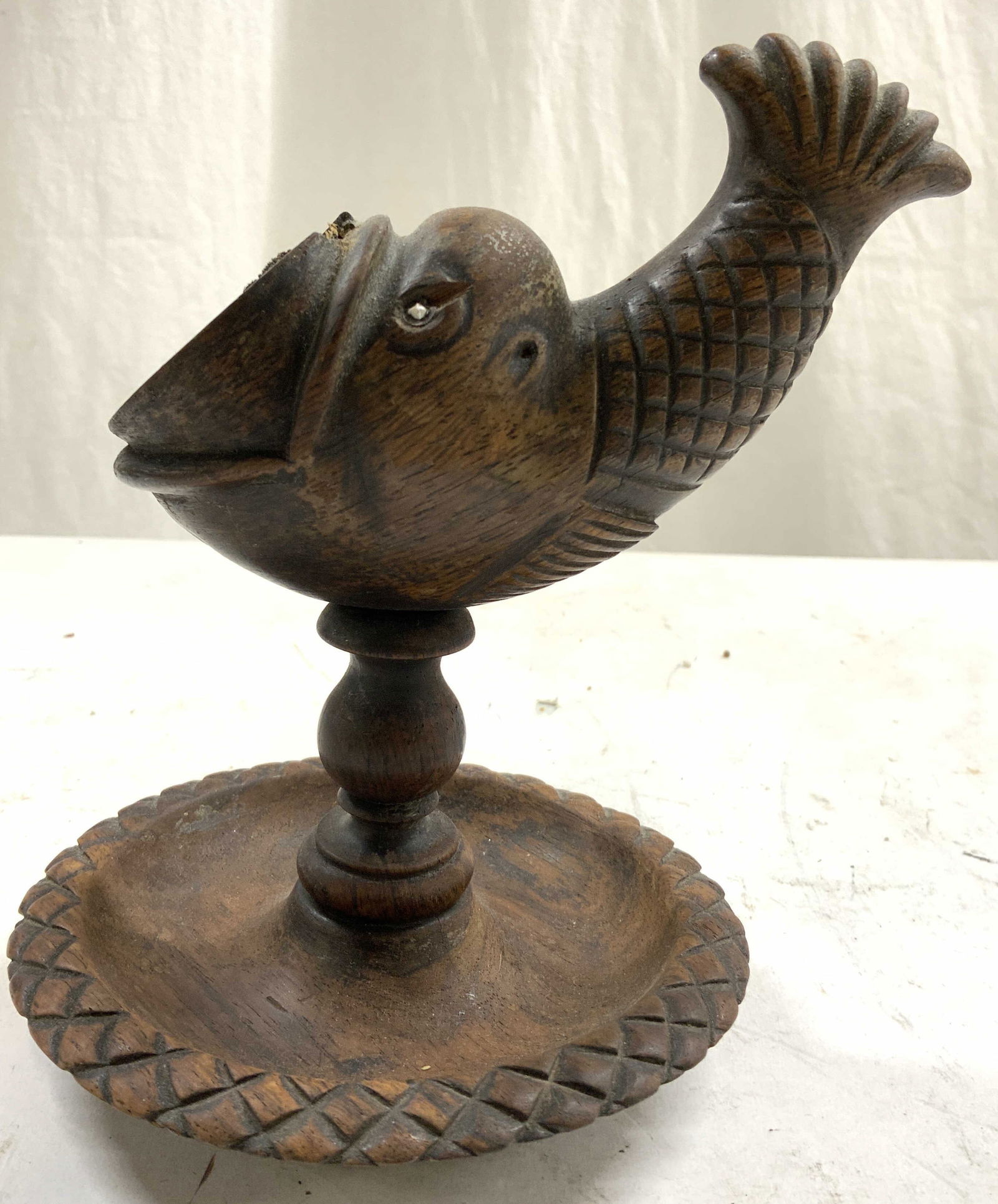Vntg Carved Wooden Fish Decor: Carved wooden pedestaled fish figure. Piece is brown toned with carved scale relief detail. Base has trinket dish shape. Piece measures approximately 6.5 inches tall and deep 5 inches wide. Fish decor