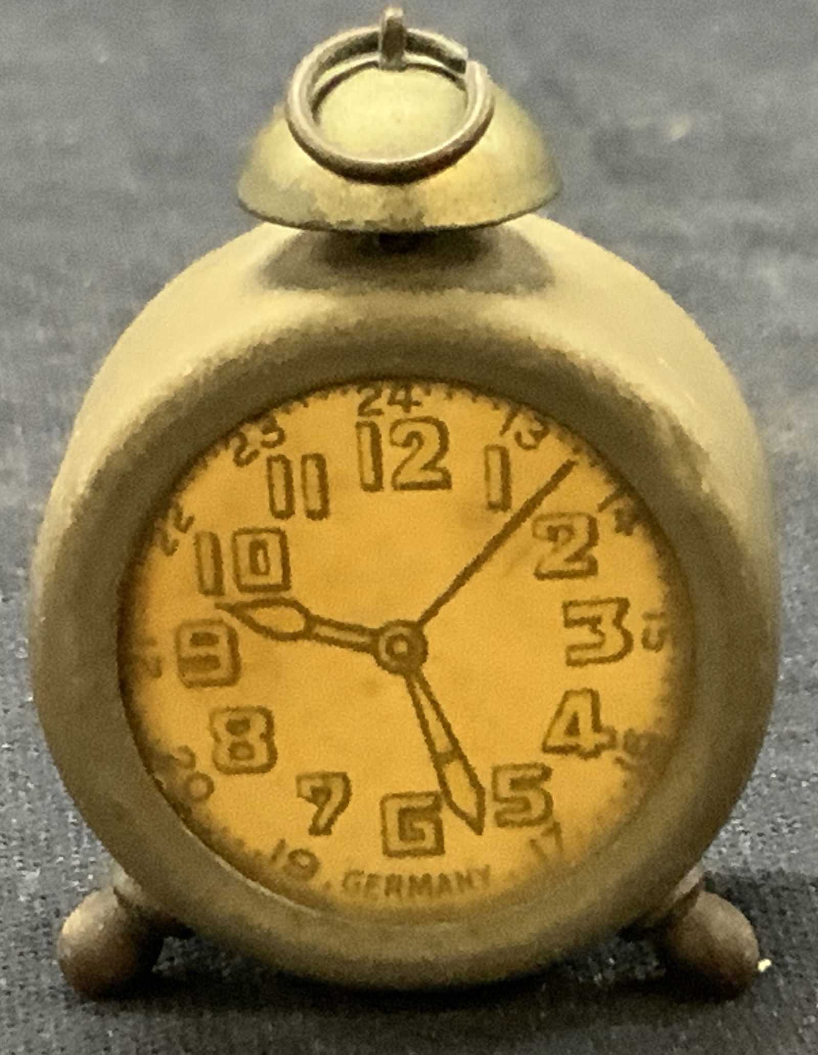 Vtg Aluminum Clock Pencil Sharpener, Germany: Vintage aluminum crafted pencil sharpener made to resemble a clock marked Germany on underside. Approx 1.5 inches tall Sharpener has evident rusting and evident wearing to metal due to age and use. No