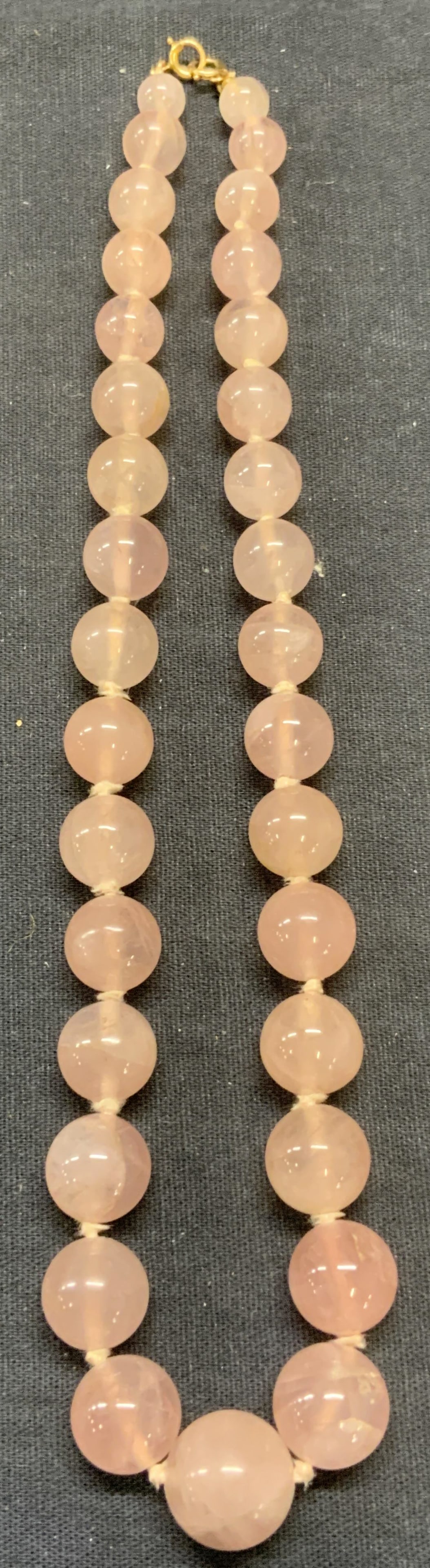 Vtg Rose Quartz Beaded Choker Necklace: Vintage rose Quartz beaded choker necklace on double knotted string. Drop length approx. 8 inches. Some surface wear including scratching observed. Estate jewelry, costume jewelry, cocktail jewelry, f