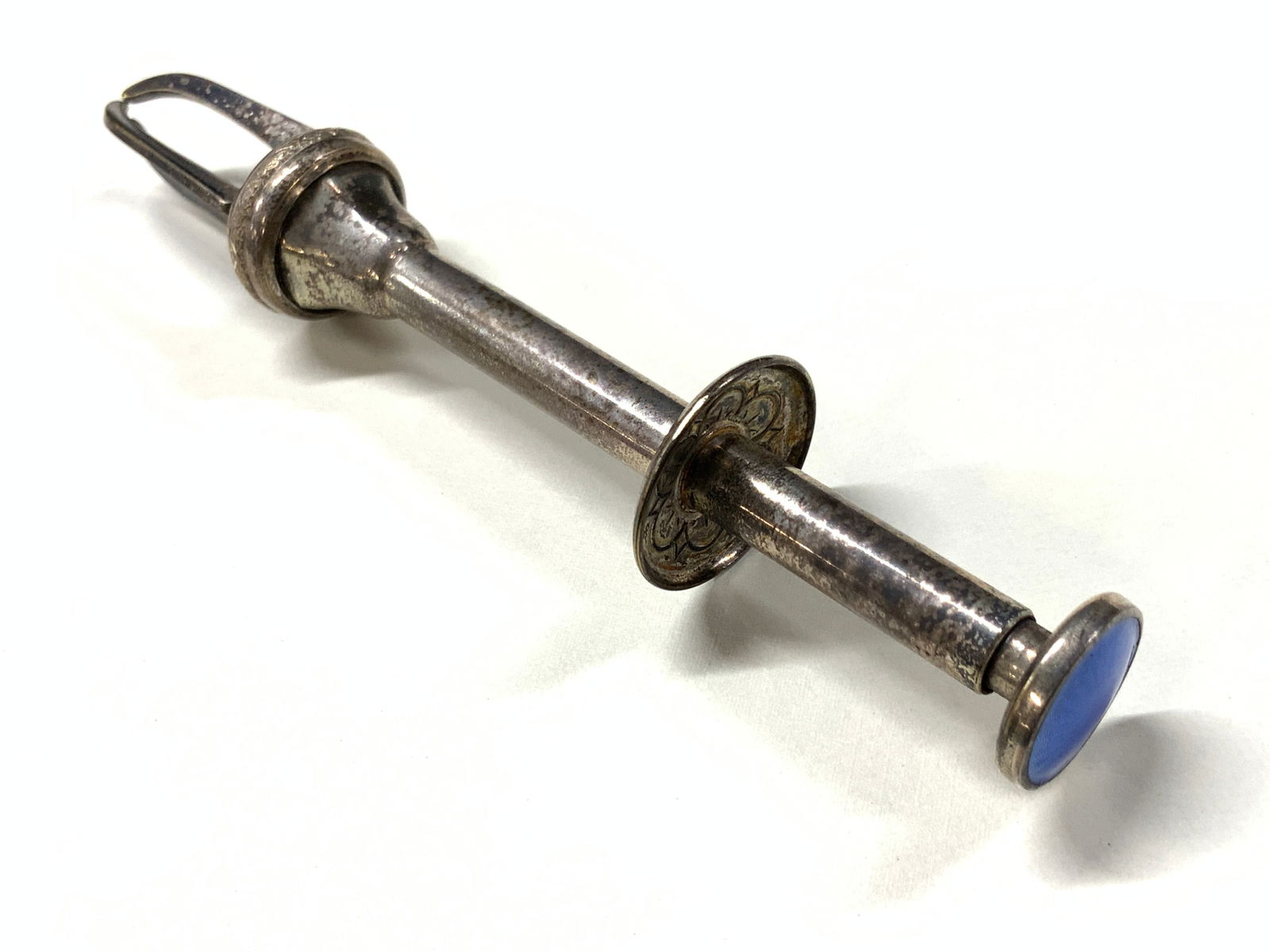 Vtg Guilloche & Sterling Silver Tongs, Norway: Vintage pair of push button tongs, made of sterling silver with guilloche blue enamel on top of push button. Approx 4.75 inches long. Marked Norway Tested positive for sterling silver using Puritest m