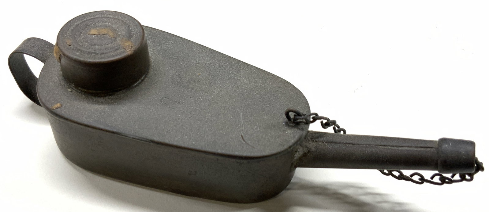 Vtg GEBR.H SCH Metal Made Oil Lamp: Marked on the bottom GEBR H SCH within a shoe shape. Vintage Metal, possibly made of iron or sheet metal oil lamp with rounded body with wick and spout with cover. Approx 1.5 Inches tall and 6 inches 