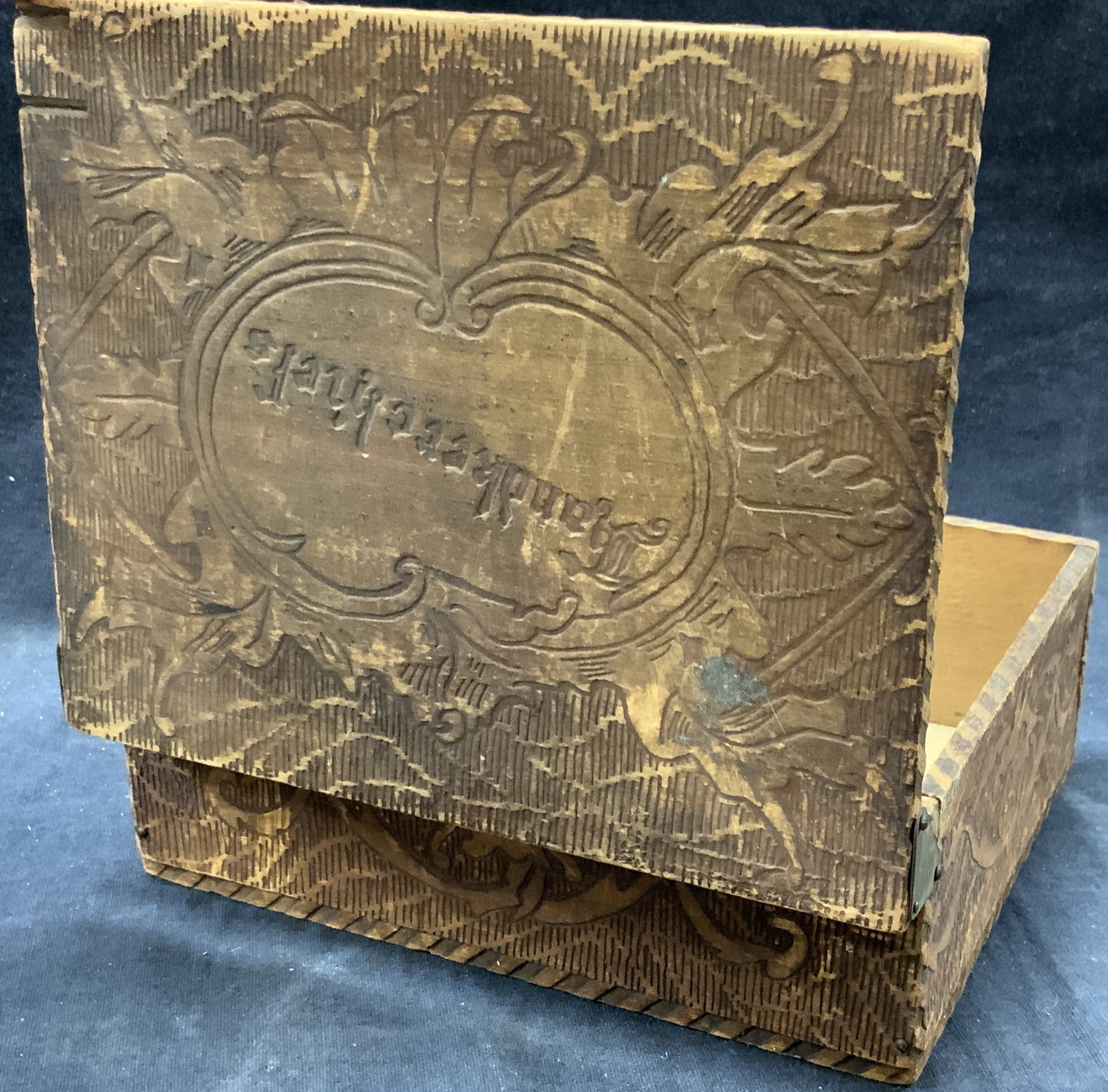 Vtg Handkerchief Etched Wooden Trinket Box: Vintage wooden trinket box with side hinges. Etched with intertwined scroll designs with lid carved with the word Handkerchiefs. Approx 5 x 6.5 x 2 inches. Evident wearing to edges of box and loss to 