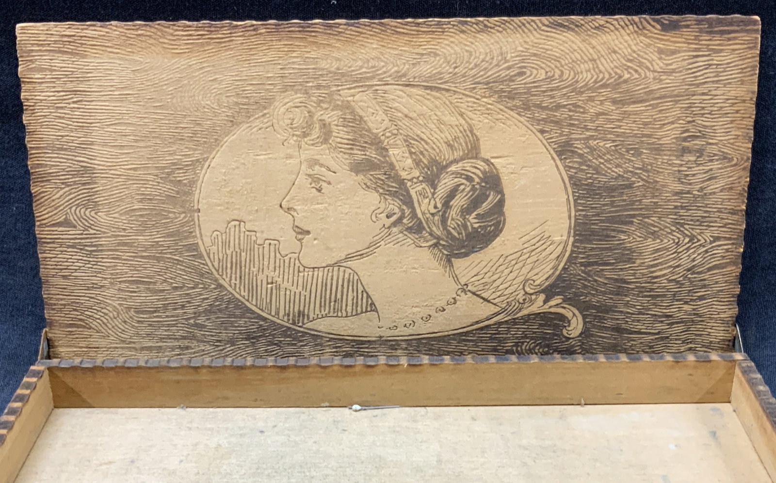 COS Carved Art Nouveau Style Wooden Trinket Box: Marked cos on lid with etchings of a profile portrait of a woman on the lid with scroll designs throughout. Approx 9 x 5 x 1 inches. Moderate wearing to wooden box due to age and use and wearing to ed