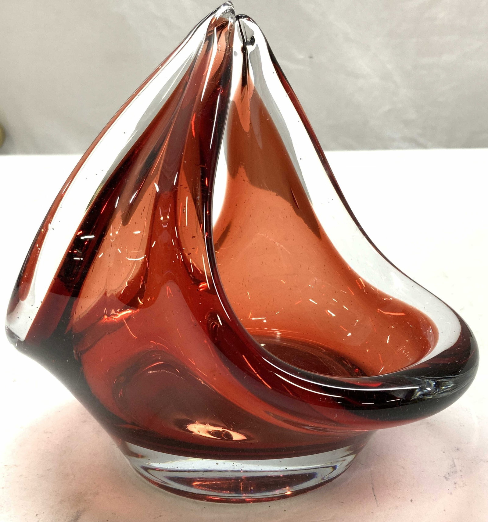 MCM FLYGCORS Blown Art Glass Basket, Sweden: Vintage Flygfors Coquille Glass Basket in red, designed by Paul Kedelv . Mid century modern Swedish Design blown art glass. Measures 5.25 in. Ht. , 4 x 5.5 in. Light surface wear. Thick rimmed glass. 