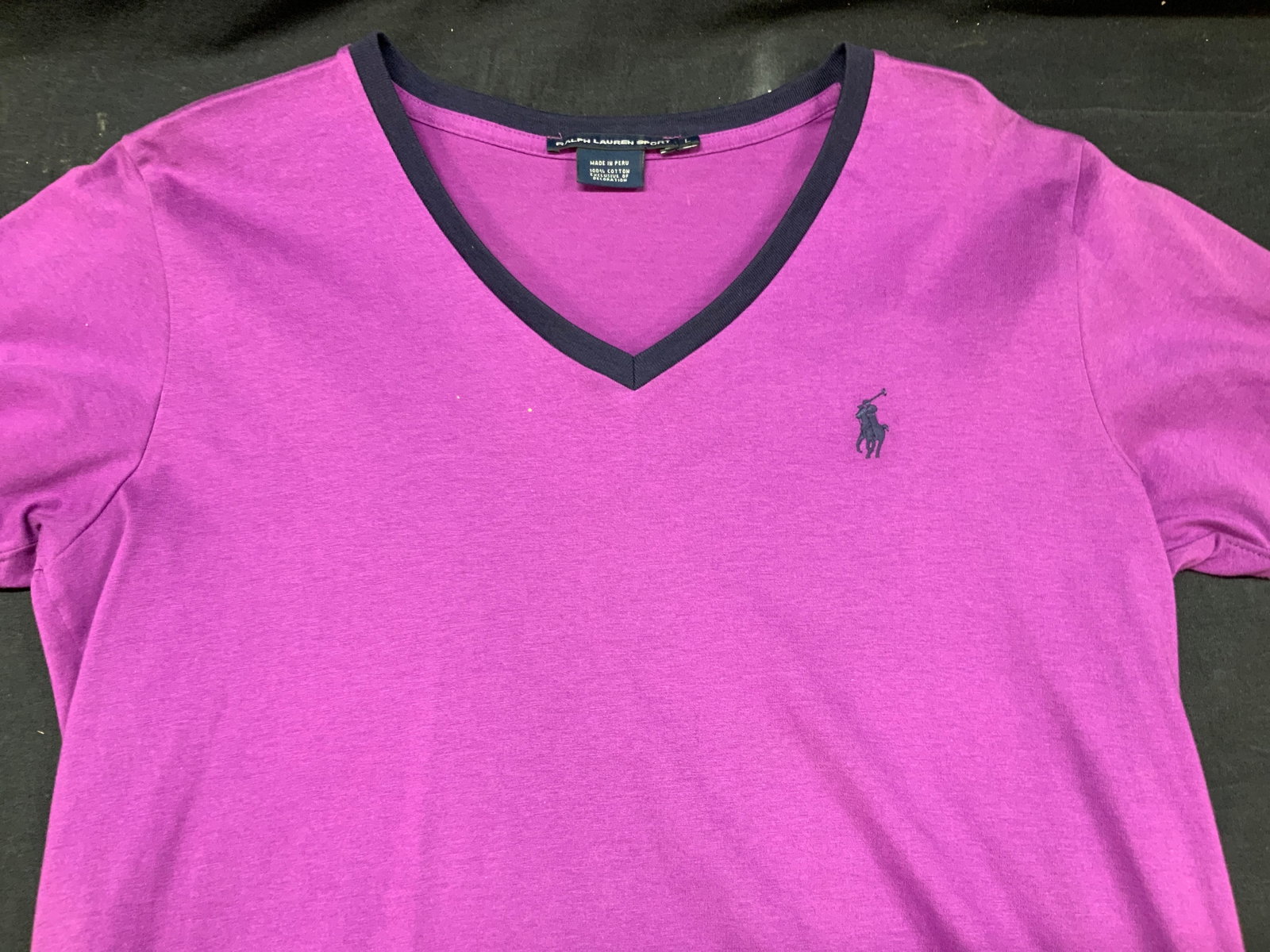 Ralph Lauren Sports V Neck Cotton Shirt: Ralph Lauren sports size L. Purple toned v neck shirt, cotton short sleeve shirt, with embroidered polo player on breast, torso measures 23 inches long and chest measures 18 inches across. Minor weari