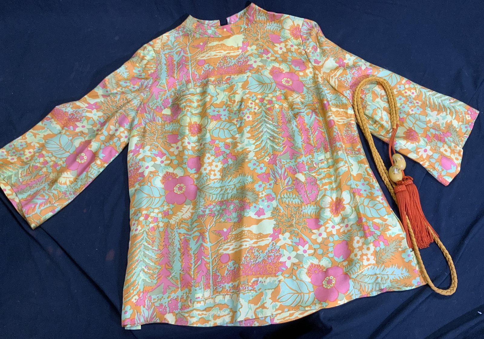 Handmade Silk Tunic Blouse w Matching Belt: Beautiful hand made silk blouse with vibrant vintage colors of Neon pinks, greens, neon orange and yellow. Depicts flowers, pine forest, tree branches, more. 27 in. Long, waist 38 in. High collar, bac