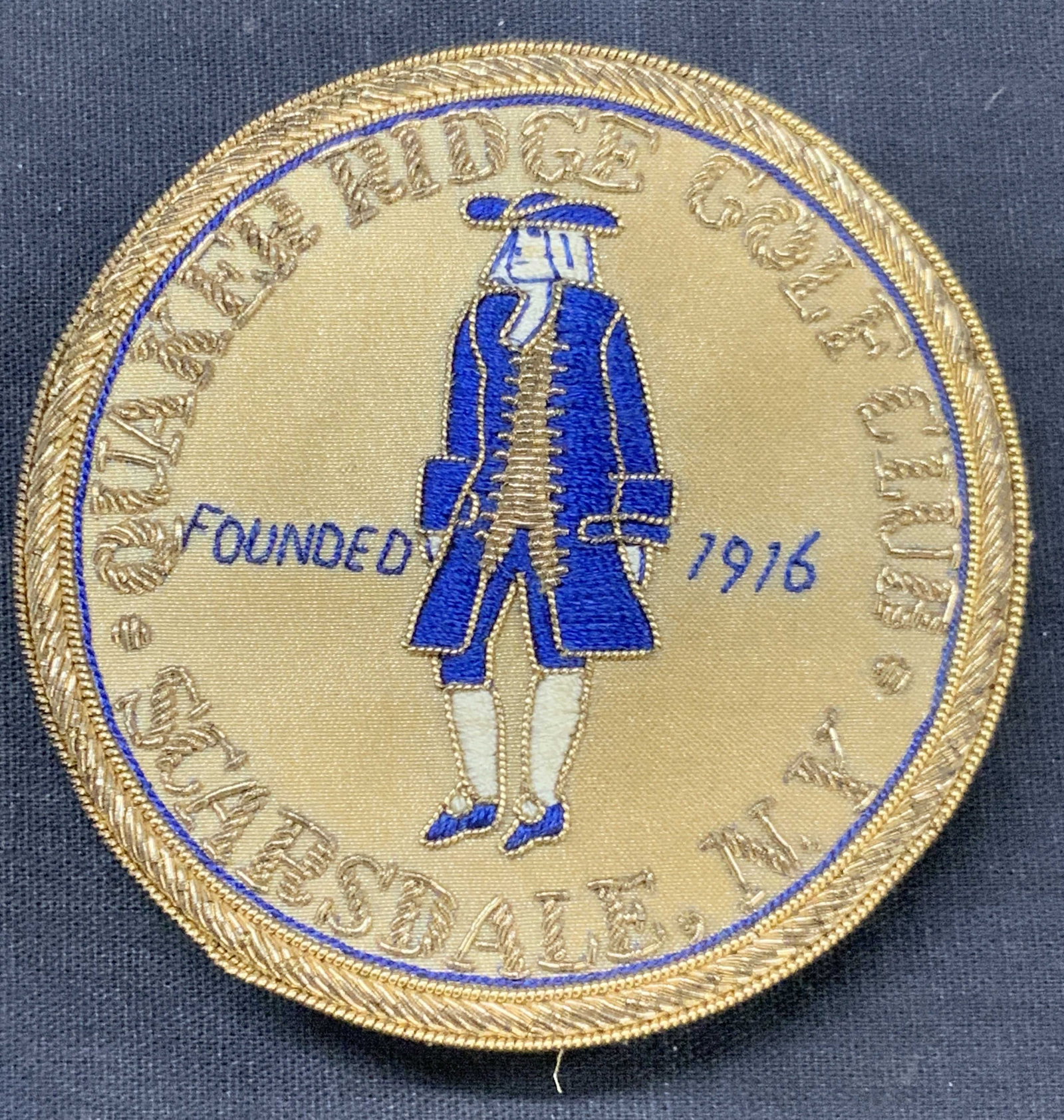Vtg Hand Embroidered Gold Club Patch: Vintage hand embroidered patch, reading Quaker Ridge golf club, Scarsdale NY depicting an image of a Quaker, marked founded 1916. Approx 3 x 3 inches Minor wearing to embroidery due to age and use Vin