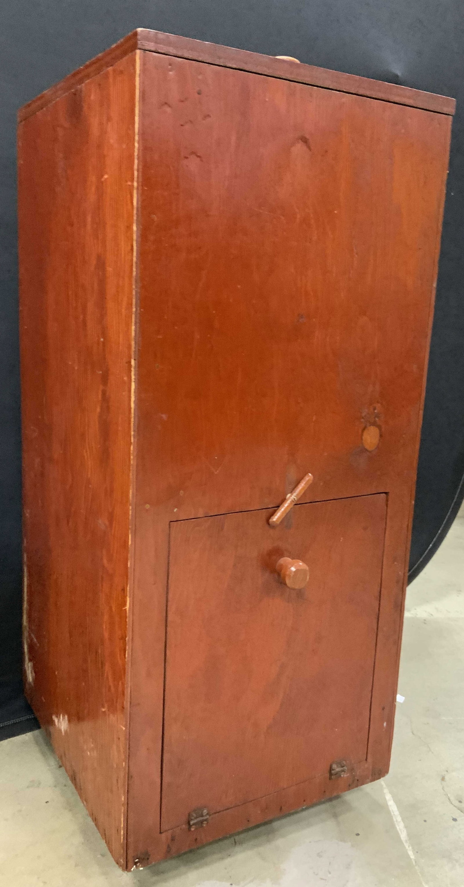 Antique Wooden Lidded Ice Chest: Ice chest appears to be antique possibly vintage. Ice chest is wooden. Piece has orange wood toned exterior and light blue toned interior. Top of piece has lid, near base of piece has door. Measures a