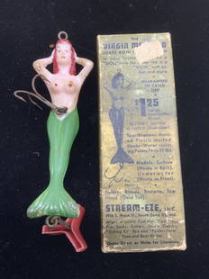 Vintage Nude Mermaid Fish Bait Hook: The Virgin Mermaid Fish Bait Hook, durable plastic with water resistant paint color, mustard hook. Measures 5.5 in. Long. Some rust to metal. Comes in part of the original box. Fishing accessory, Fish