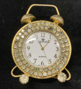 CANNES Handmade Gold Tn Crystal Quartz Clock: Easel Back Side table Cannes battery operated clock. Gold tone with clear crystals, Quartz clock, Japan movement. Made in the USA .3.5 x 2.25 in. Timepiece, Cannes Handmade Side table clock,