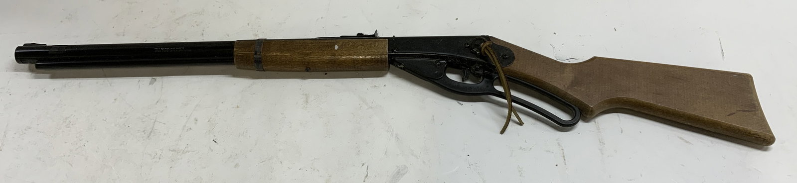 Daisy 1938B Red Ryder BB Gun: Daisy model number 1938B Red Ryder BB air gun. Steel and wood. Measures approx. 36 inches long. Interior not inspected, not inspected for function. Surface wear including scratching observed. Daisy BB
