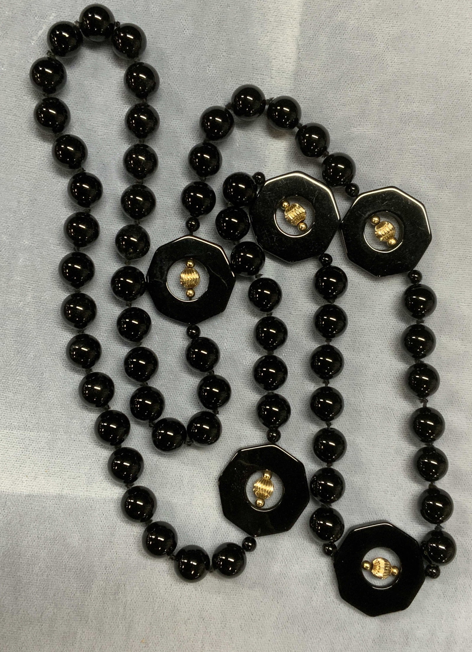 Gold Tone Black Gemstone Beaded Necklace: Black gemstone beaded necklace with gold tone accent beads. Drop length approx. 16 inches. Some surface wear including scratching observed. Estate jewelry, fine jewelry, cocktail jewelry, fashion jewe