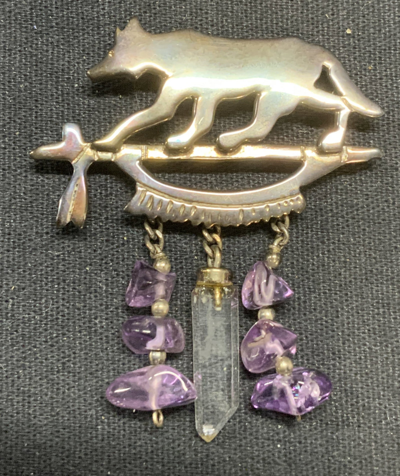 Signed Sterling Silver & Amethyst Wolf Brooch: Signed sterling silver world brown with amethyst gemstones. Signed BL to underside, marked sterling. Hinge pin to underside. Measures approx. 2 x 1.75 inches. Total weight 7.5 grams. Some surface wear