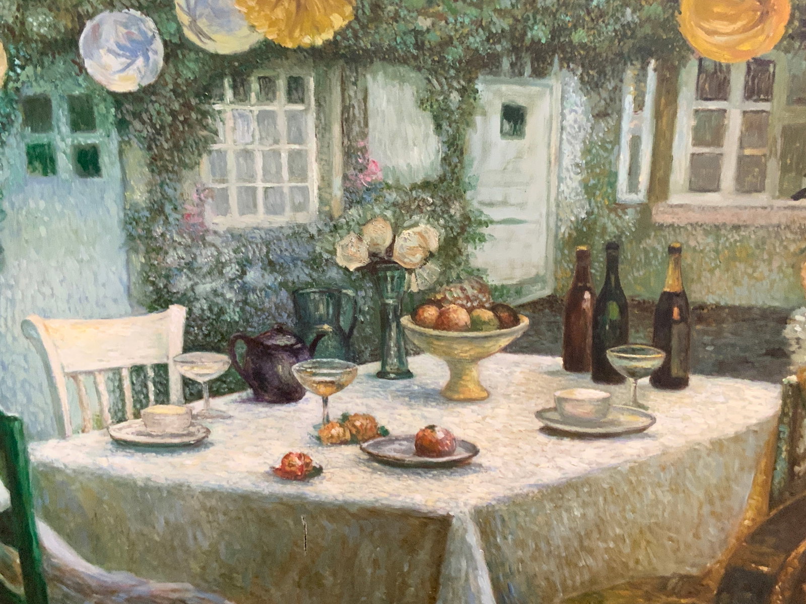 Vtg Exterior Party Scene Oil On Canvas 40in: Vintage oil on canvas painting depicting an exterior scene with a dinning table, with wine bottles and table settings with ornaments hanging above. No frame, approx 30 x 40 inches Evident tear to canv
