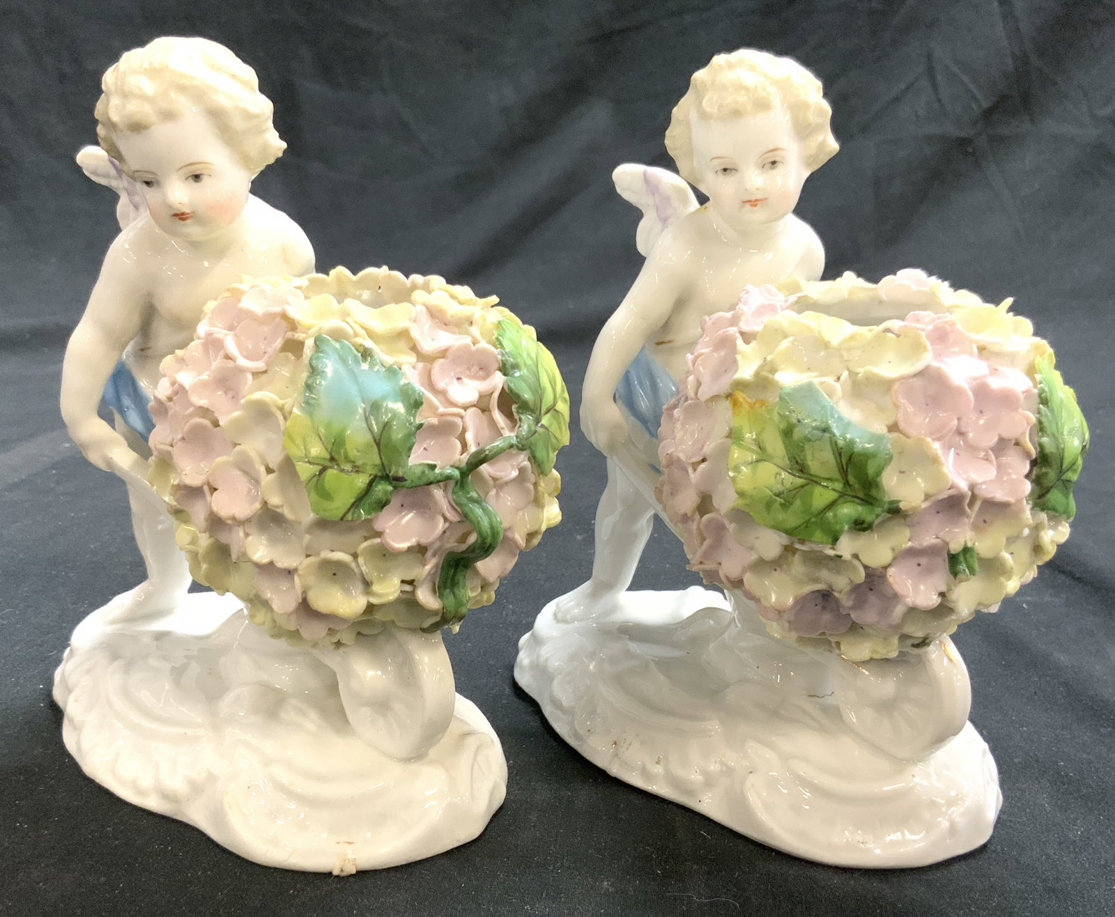 MEISSEN SCHNEEBALLEN Antq Pr Porc Cherub Vases: Vases appear to be Meissen Schneeballen (no apparent markings). Each appear to be antique possibly vintage. Lot includes 2 vases. Each with cherub figures pushing a wheelbarrow full of flowers. Each a