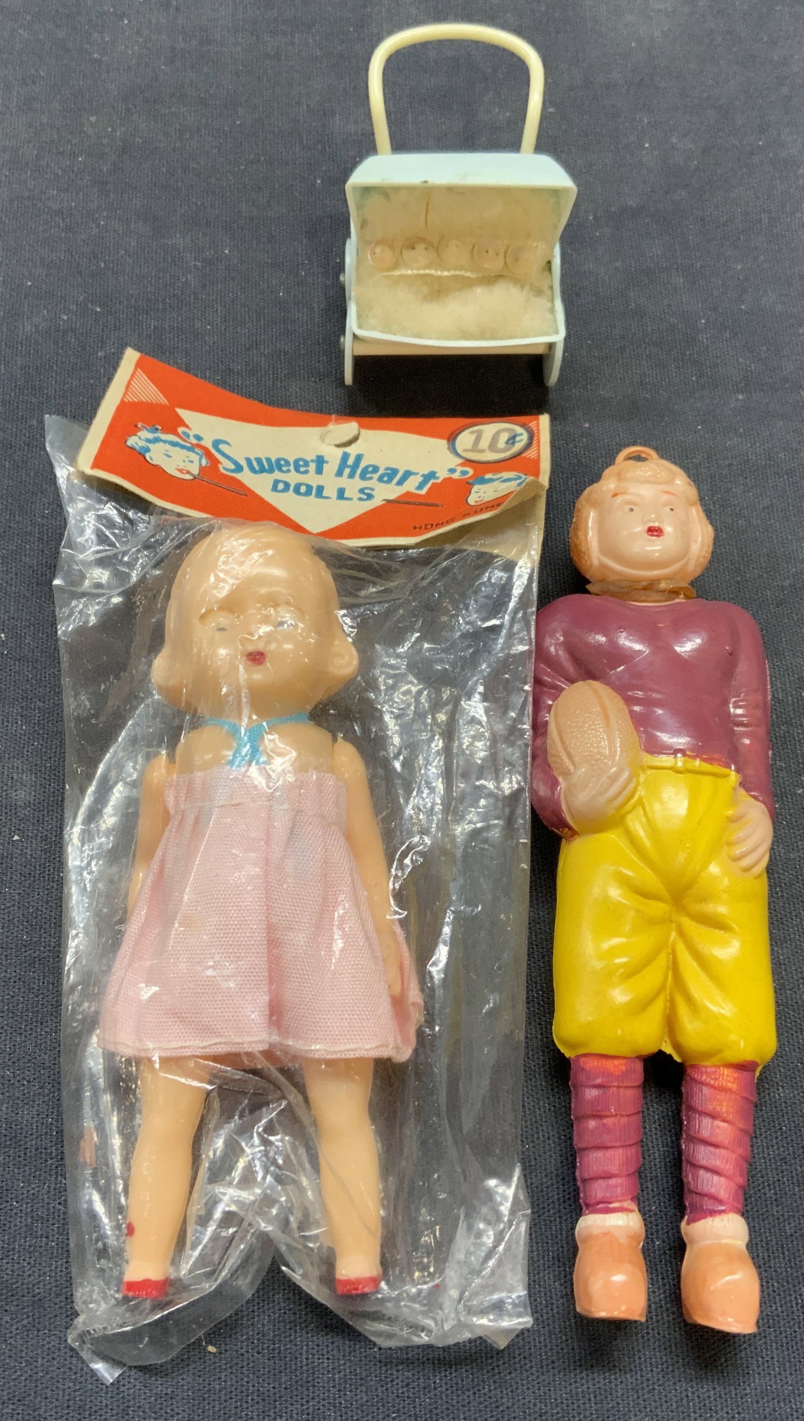 Lot 3 Vtg Sweet Heart Doll NIP, More: Lot of 3 pieces. Vintage Sweet Heart doll. New in package. Vintage football player doll. Vintage doll stroller. All pieces composed of plastic. Largest measures approx. 4.5 x 1.25 inches. All pieces h
