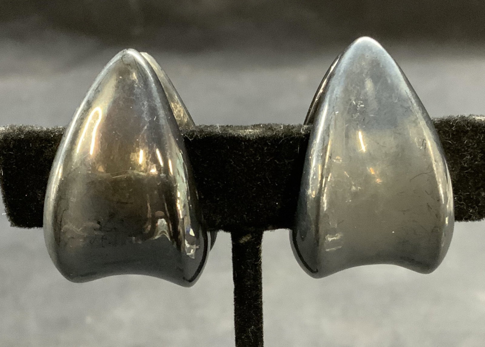 Vintage Sterling Silver Earrings: Vintage sterling silver clip in earrings. Measure approx. 1.25 x .75 inches. Total weight .69 ozt. Tests for sterling using PuriTEST kit. Some surface wear including scratching observed. Estate jewelr